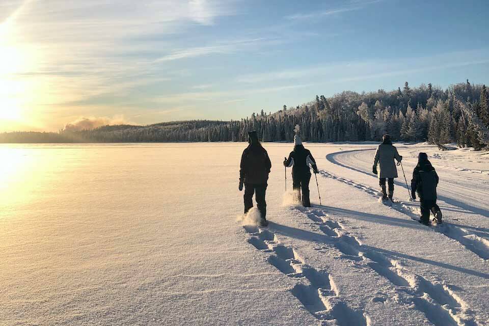 Snowshoers make fresh tracks on Headquarters Lake on a weekly guided walk at Kenai National Wildlife? Refuge. (Photo by USFWS/Leah Eskelin/USFWS)