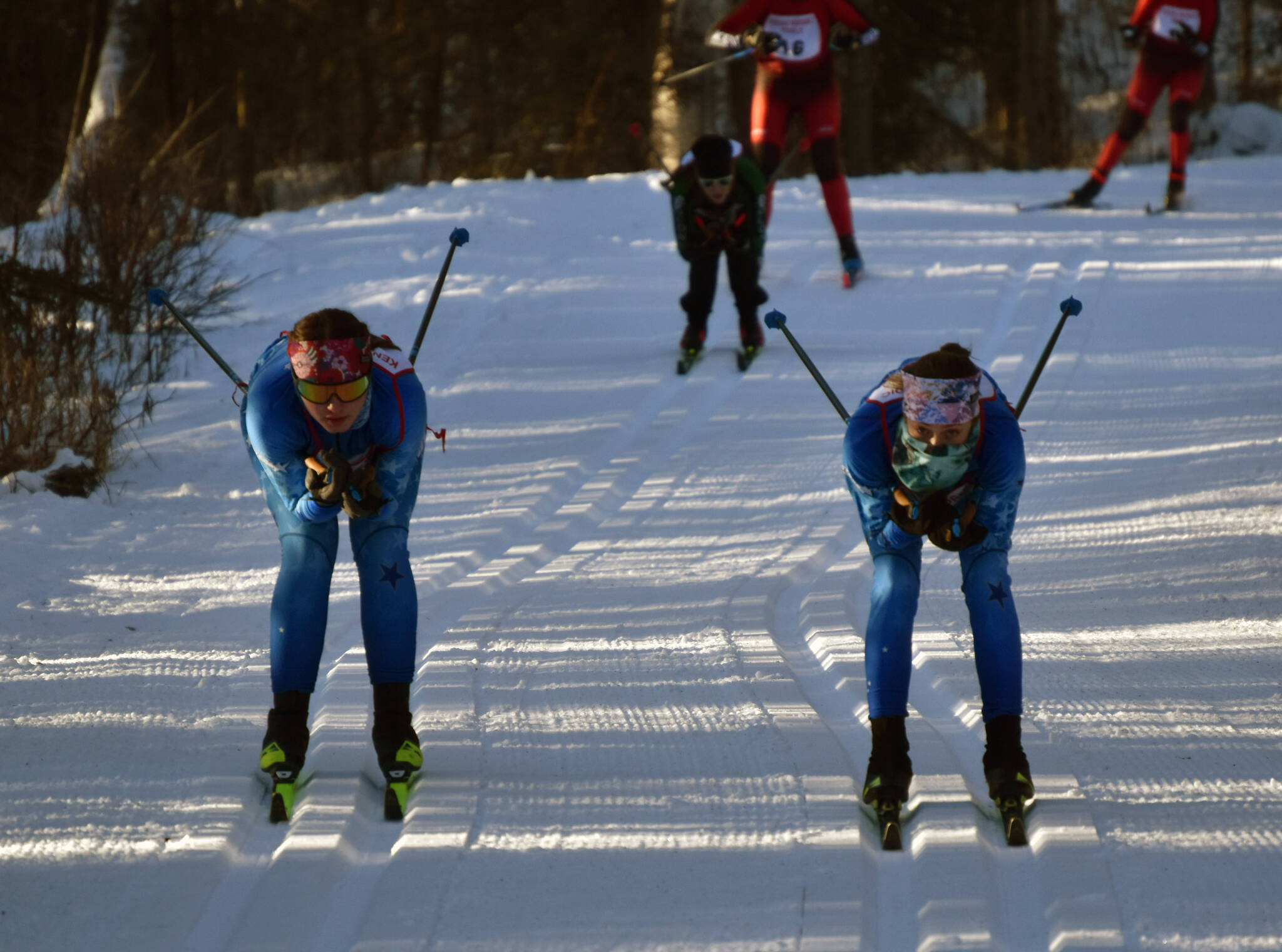 Soldotna’s Ariana Cannava and Tania Boonstra lead the pack at the Kardinal Klassic on Friday, Jan. 26, 2024, at Tsalteshi Trails just outside of Soldotna, Alaska. (Photo by Jeff Helminiak/Peninsula Clarion)