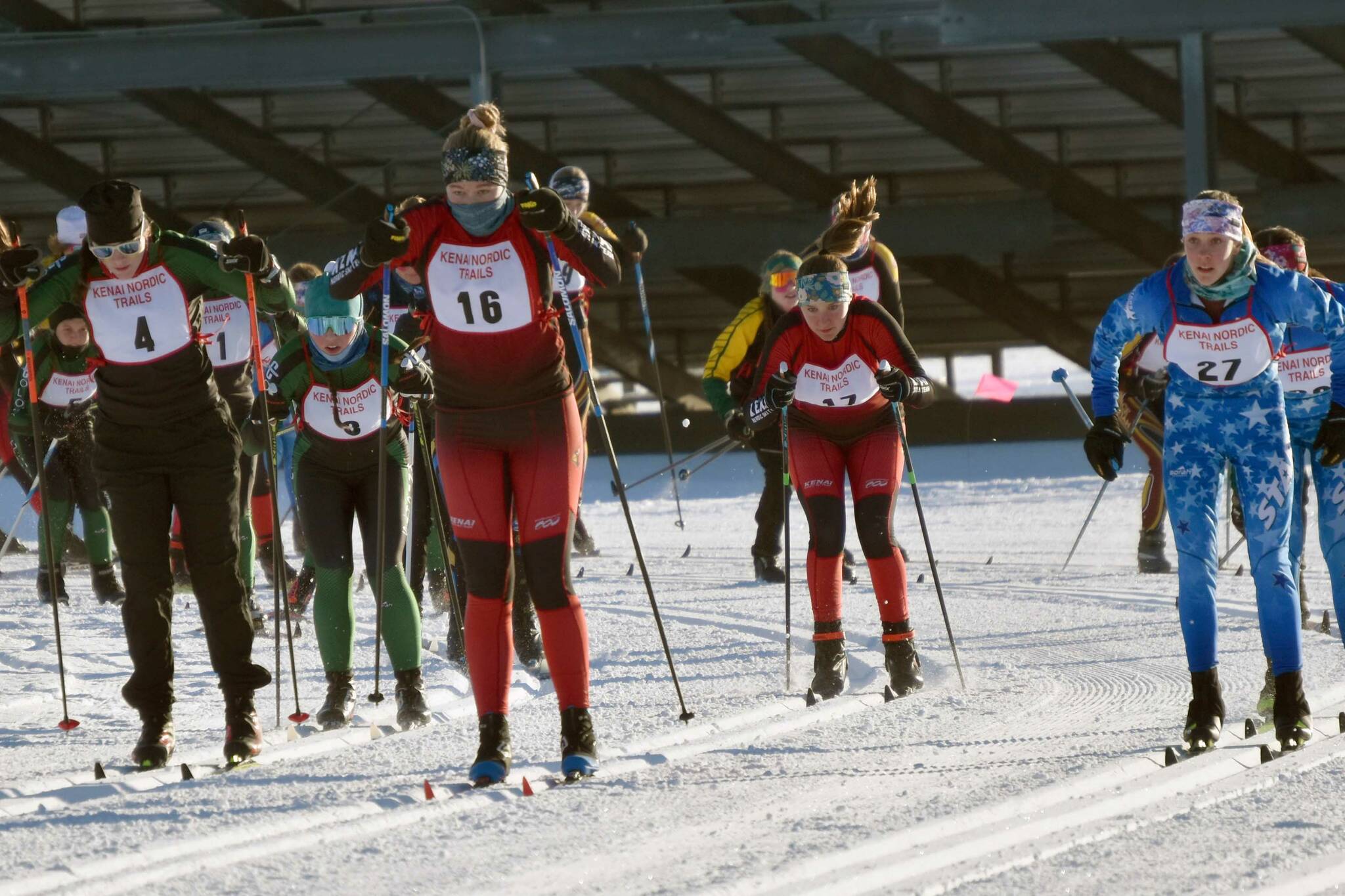 Kenai Central's Emily Moss leads the pack at the start of the Kardinal Klassic on Friday, Jan. 26, 2024, at Tsalteshi Trails just outside of Soldotna, Alaska. (Photo by Jeff Helminiak/Peninsula Clarion)