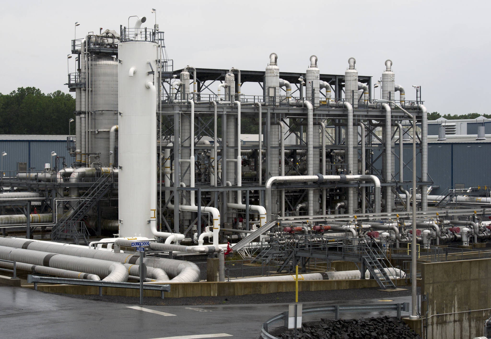 A heat exchanger and transfer pipes at Dominion Energy’s Cove Point LNG Terminal in Lusby, Md., June 12, 2014. The Biden administration is delaying consideration of new natural gas export terminals in the United States, even as gas shipments to Europe and Asia have soared since Russia’s invasion of Ukraine. (AP Photo/Cliff Owen, File)