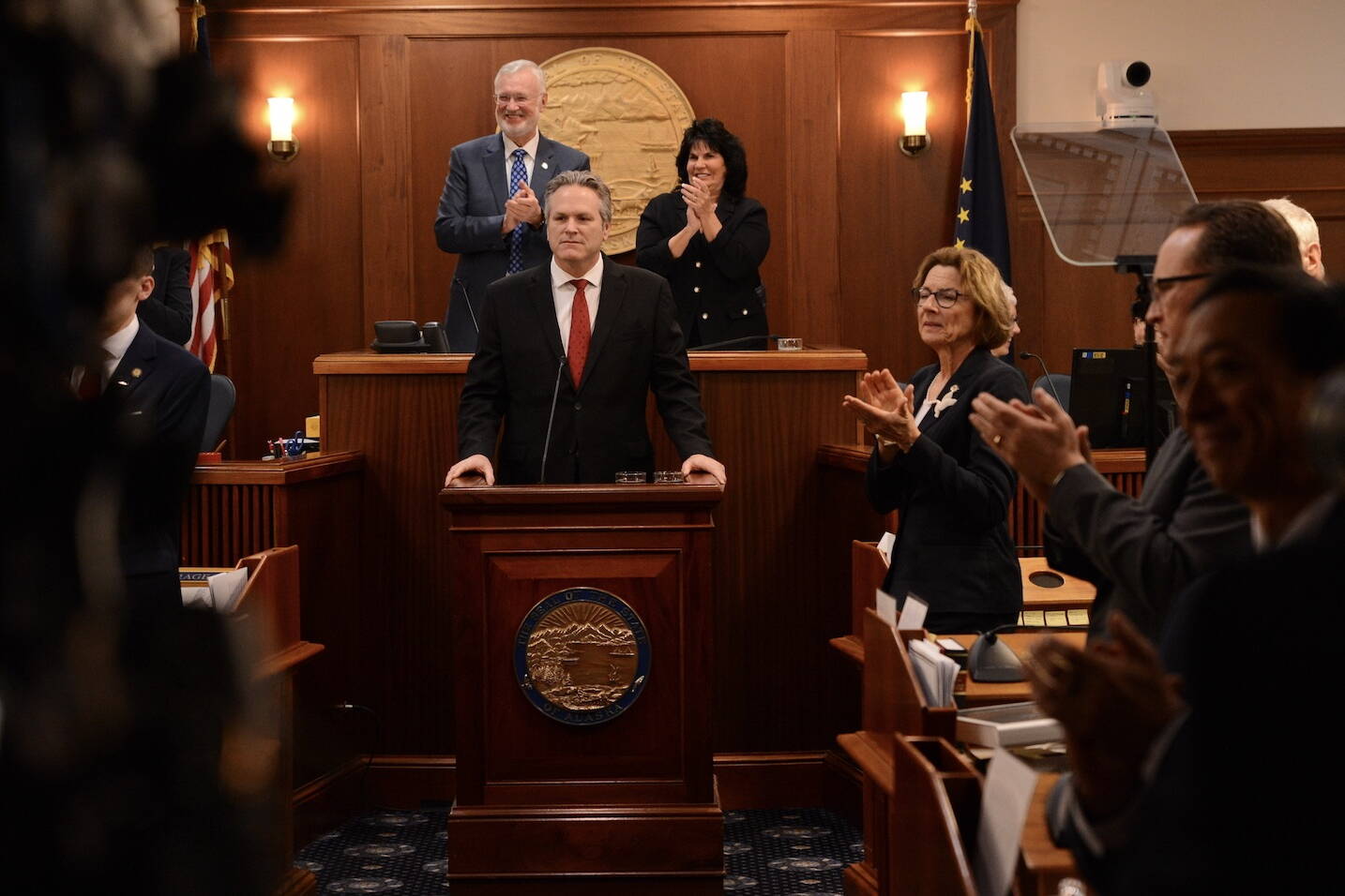 Attendees of the 2024 Alaska State of the State address applaud Rose Dunleavy, Alaska’s first lady, on Tuesday. (Photo by James Brooks/Alaska Beacon)