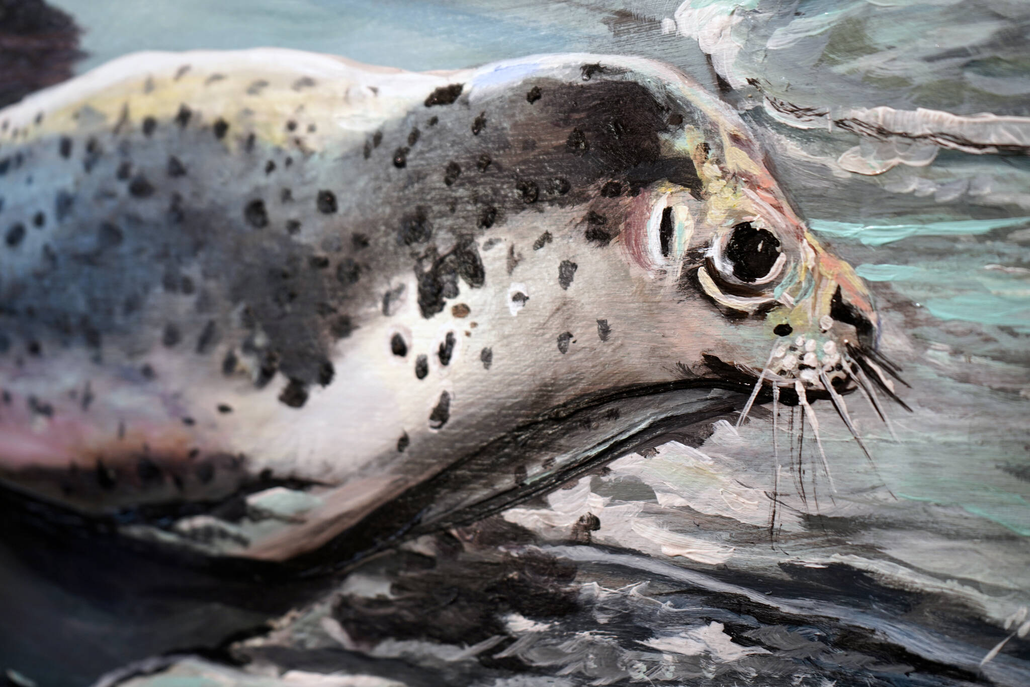 “Rescued Seal Pup Release, Kenai River, Sept. 23, 2023,” by Susan Watkins, is included as part of the People’s Choice Judged Exhibition at the Kenai Art Center in Kenai, Alaska, on Wednesday, Jan. 31, 2024. (Jake Dye/Peninsula Clarion)