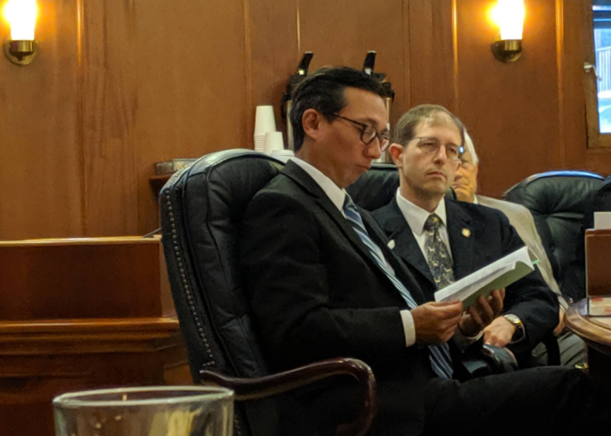 Sen. Scott Kawasaki, D-Fairbanks, and Sen. Jesse Kiehl, D-Juneau, listen during the Senate’s floor session Saturday, July 20, 2019.