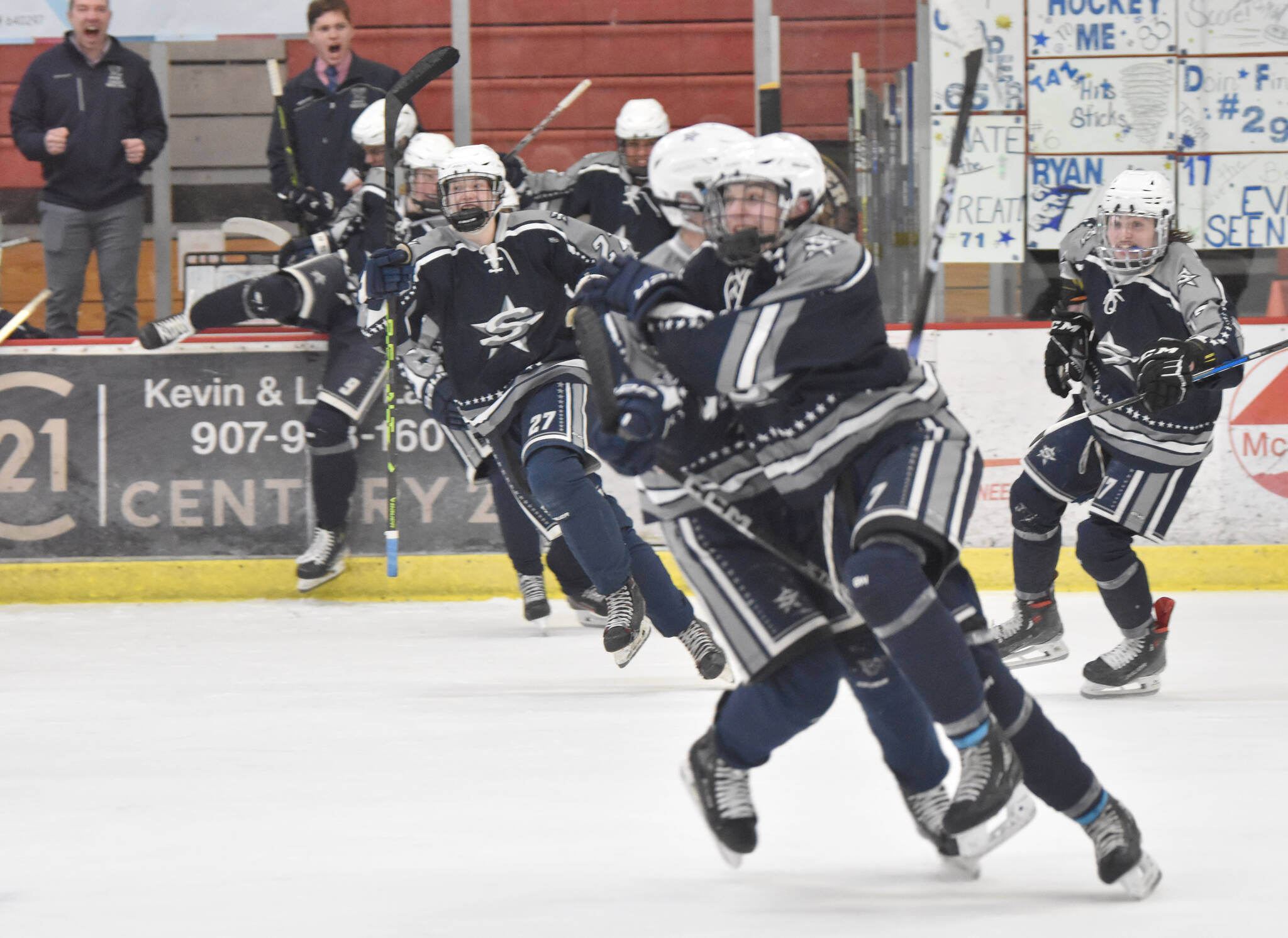 Soldotna’s Jace Appelhans (front of pack) celebrates his game-winning goal over Palmer in overtime at the Division II state tournament Friday, Feb. 2, 2024, at the Soldotna Regional Sports Complex in Soldotna, Alaska. (Photo by Jeff Helminiak/Peninsula Clarion)