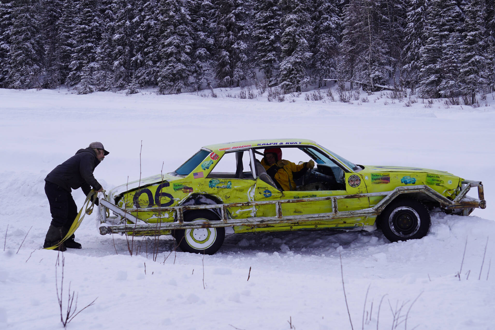Ralph Mills waits to be towed from a snow berm during Kenai Peninsula Ice Racing at the Decanter Inn in Kasilof, Alaska, on Sunday, Feb. 4, 2024. (Jake Dye/Peninsula Clarion)