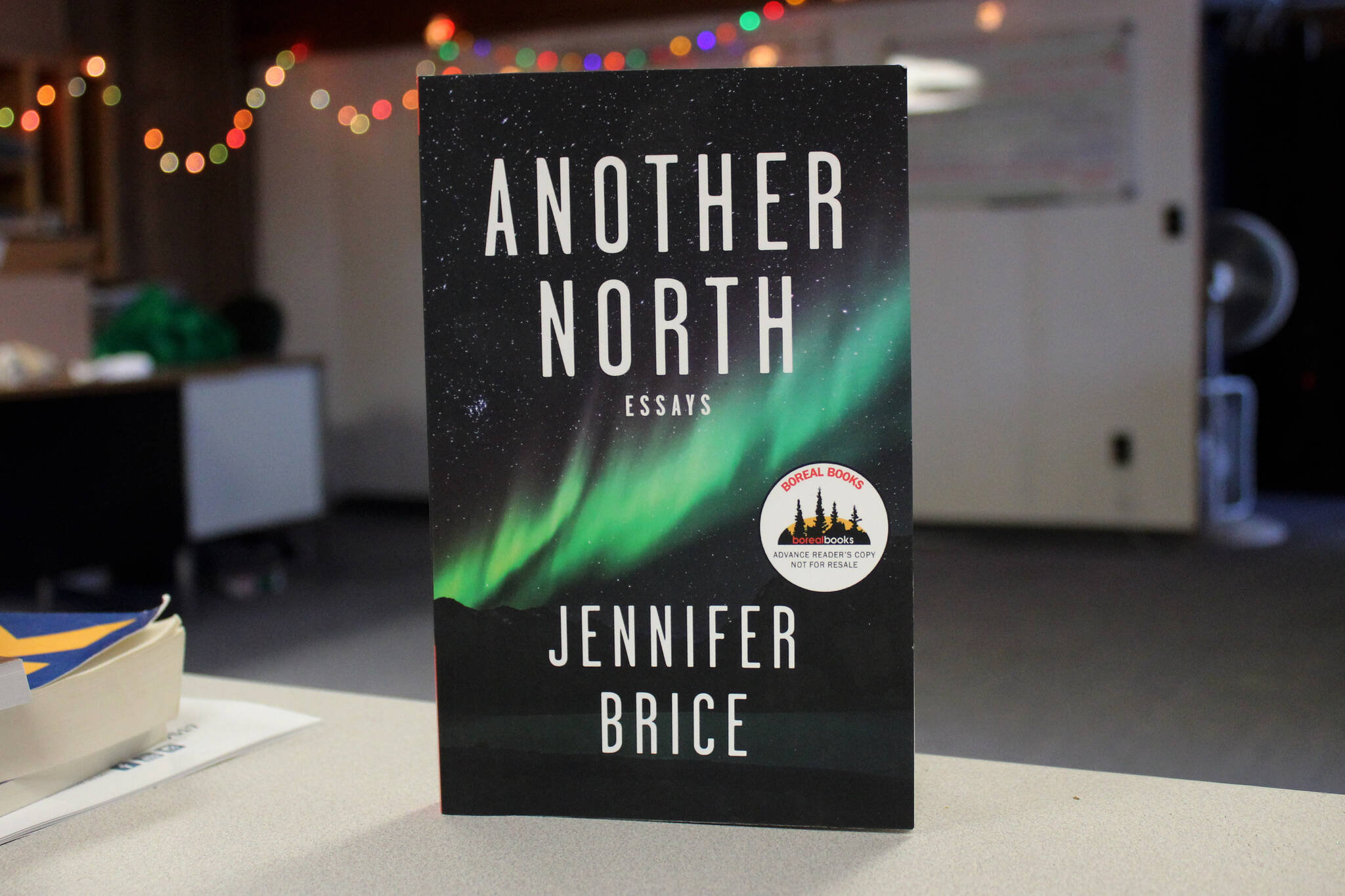 A copy of Jennifer Brice’s “Another North: Essays” rests on a desk inside the Peninsula Clarion offices on Thursday, Feb. 8, 2024 in Kenai, AK. (Ashlyn O’Hara/Peninsula Clarion)