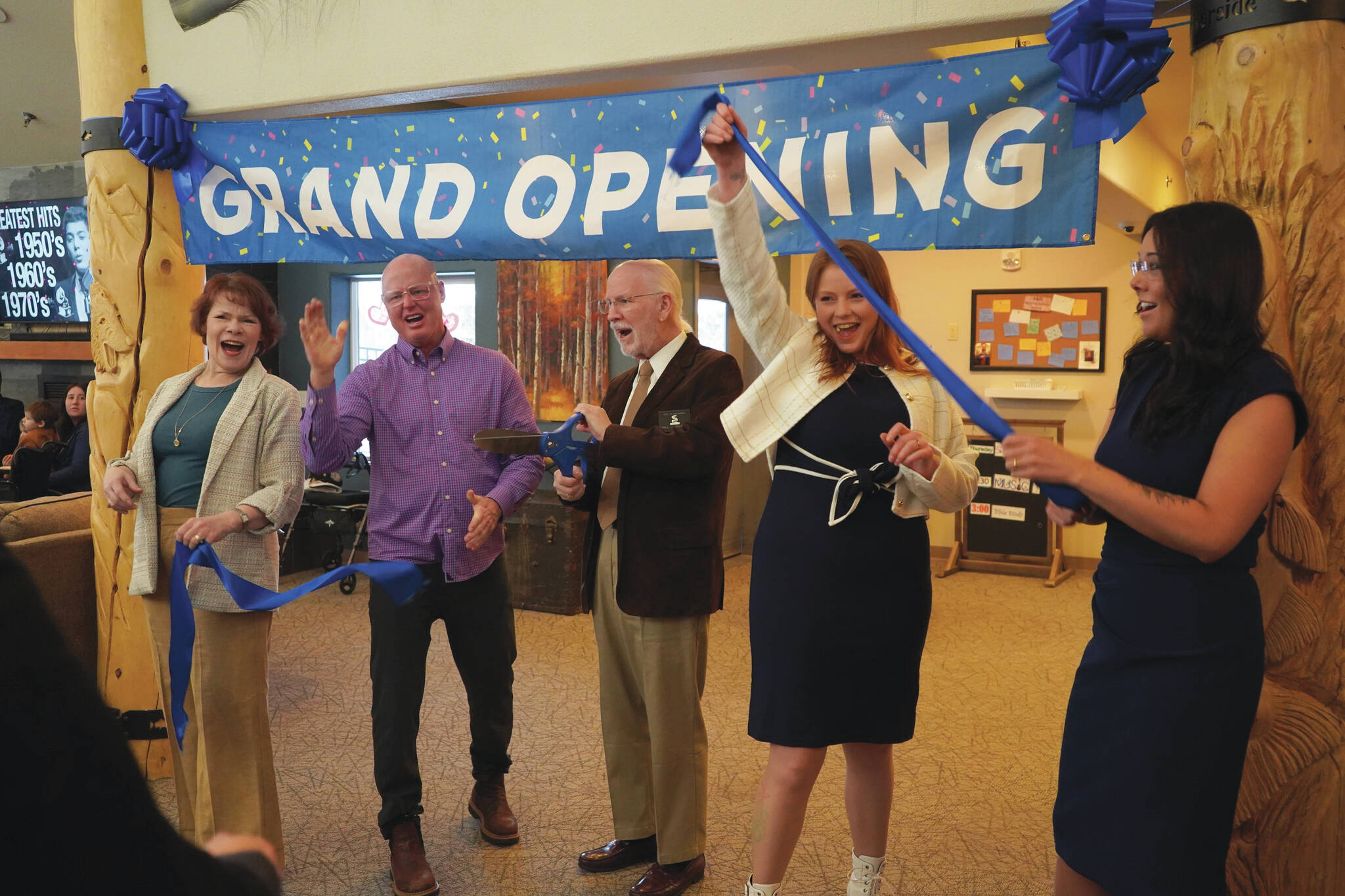 Jake Dye/Peninsula Clarion
Soldotna Mayor Paul Whitney, center, and representatives of Aspen Creek Senior Living celebrate a ribbon-cutting during a grand opening event at Aspen Creek Senior Living in Soldotna, Feb. 9.