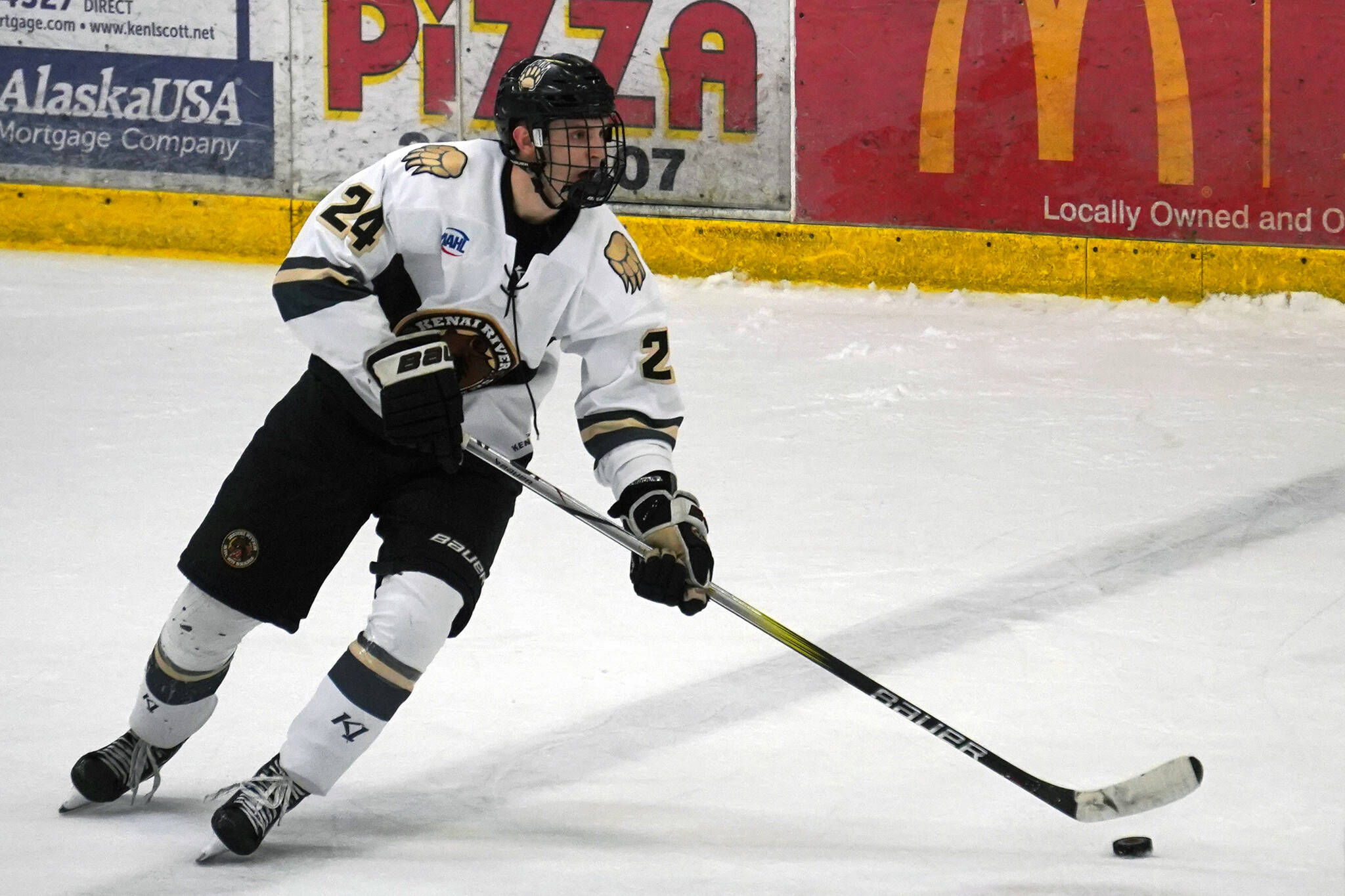 Kenai River’s Luke Hause moves with the puck during a hockey game at the Soldotna Regional Sports Complex in Soldotna, Alaska, on Friday, Feb. 16, 2024. (Jake Dye/Peninsula Clarion)