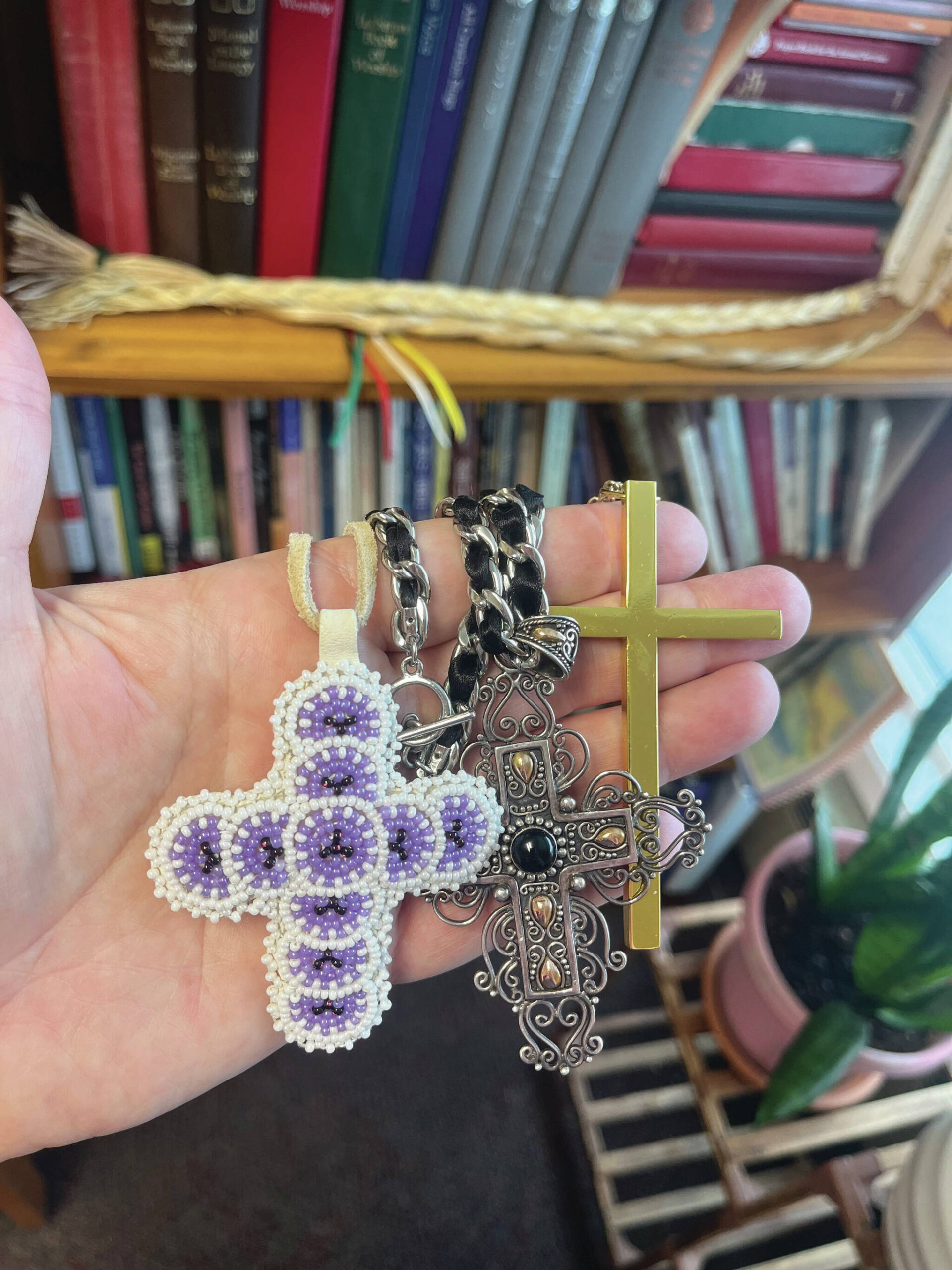 Christ Lutheran Church Pastor Meredith Harber displays necklaces featuring the cross in this undated photo. (Photo by Meredith Harber/courtesy)