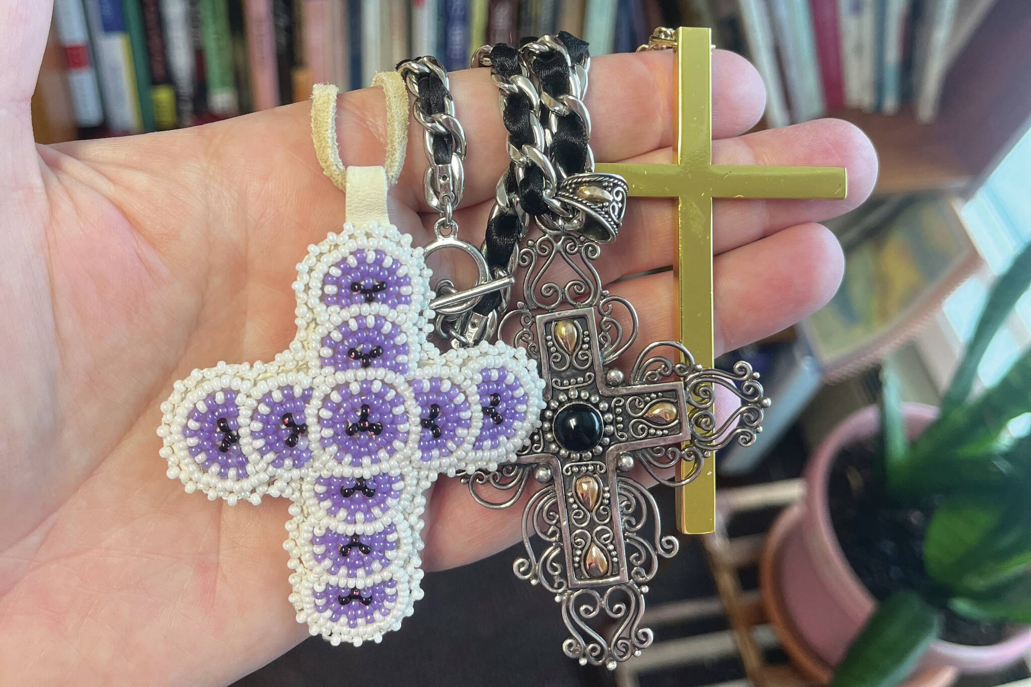 Christ Lutheran Church Pastor Meredith Harber displays necklaces featuring the cross in this undated photo. (Photo by Meredith Harber/courtesy)
