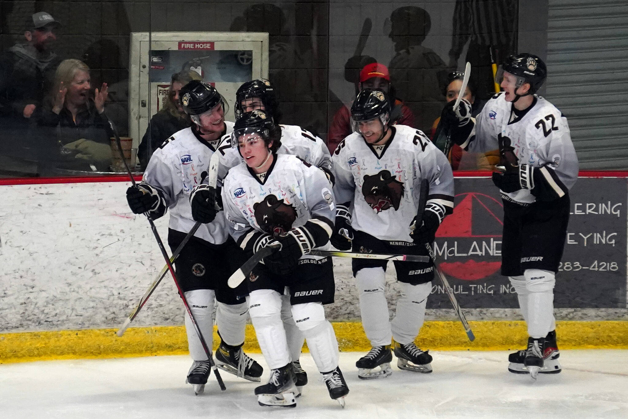 The Kenai River Brown Bears celebrate a goal by Dylan Contreras, center, during a hockey game at the Soldotna Regional Sports Complex in Soldotna, Alaska, on Friday, Feb. 23, 2024. (Jake Dye/Peninsula Clarion)