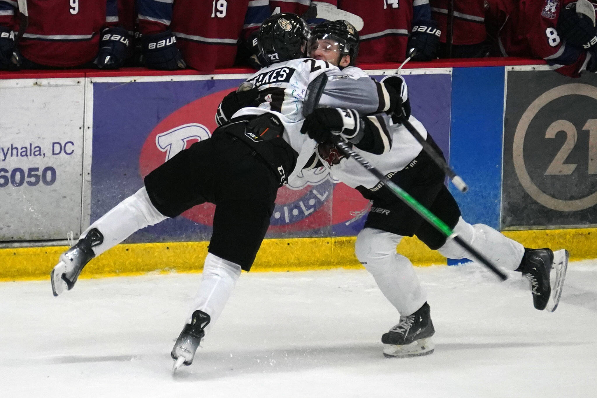 Kenai River’s Brady Engelkes celebrates a hat trick with his teammates during a game against Fairbanks at the Soldotna Regional Sports Complex in Soldotna, Alaska, on Saturday, Feb. 24, 2024. (Jake Dye/Peninsula Clarion)