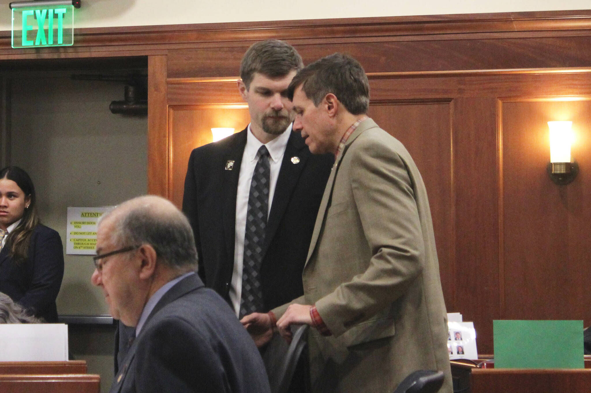 From left: Sen. Jesse Bjorkman, R-Nikiski, and Sen. Bill Wielechowski, D-Anchorage, speak during an at-ease on debate on education legislation on Monday, Feb. 26, 2024, in Juneau, Alaska. (Ashlyn O’Hara/Peninsula Clarion)