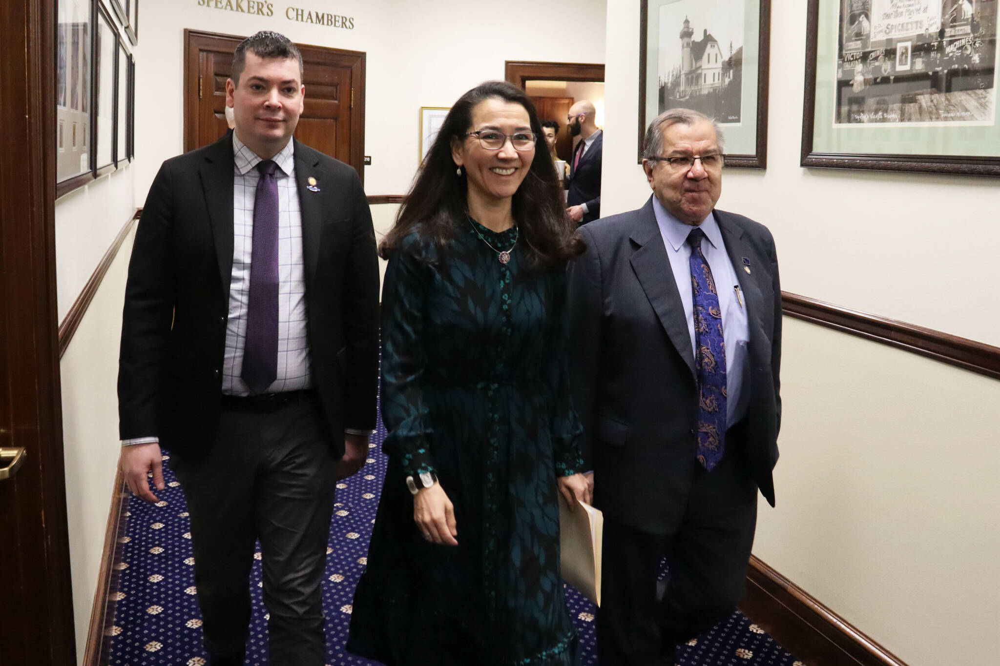 U.S. Rep. Mary Peltola (center) walks with Alaska Rep. Will Stapp, R-Fairbanks, and Alaska Sen. Lyman Hoffman, D-Bethel, into the Alaska House of Representatives chambers ahead of her annual address to the Alaska Legislature on Monday, Feb. 26, 2024 in Juneau, Alaska. (Mark Sabbatini/Juneau Empire)