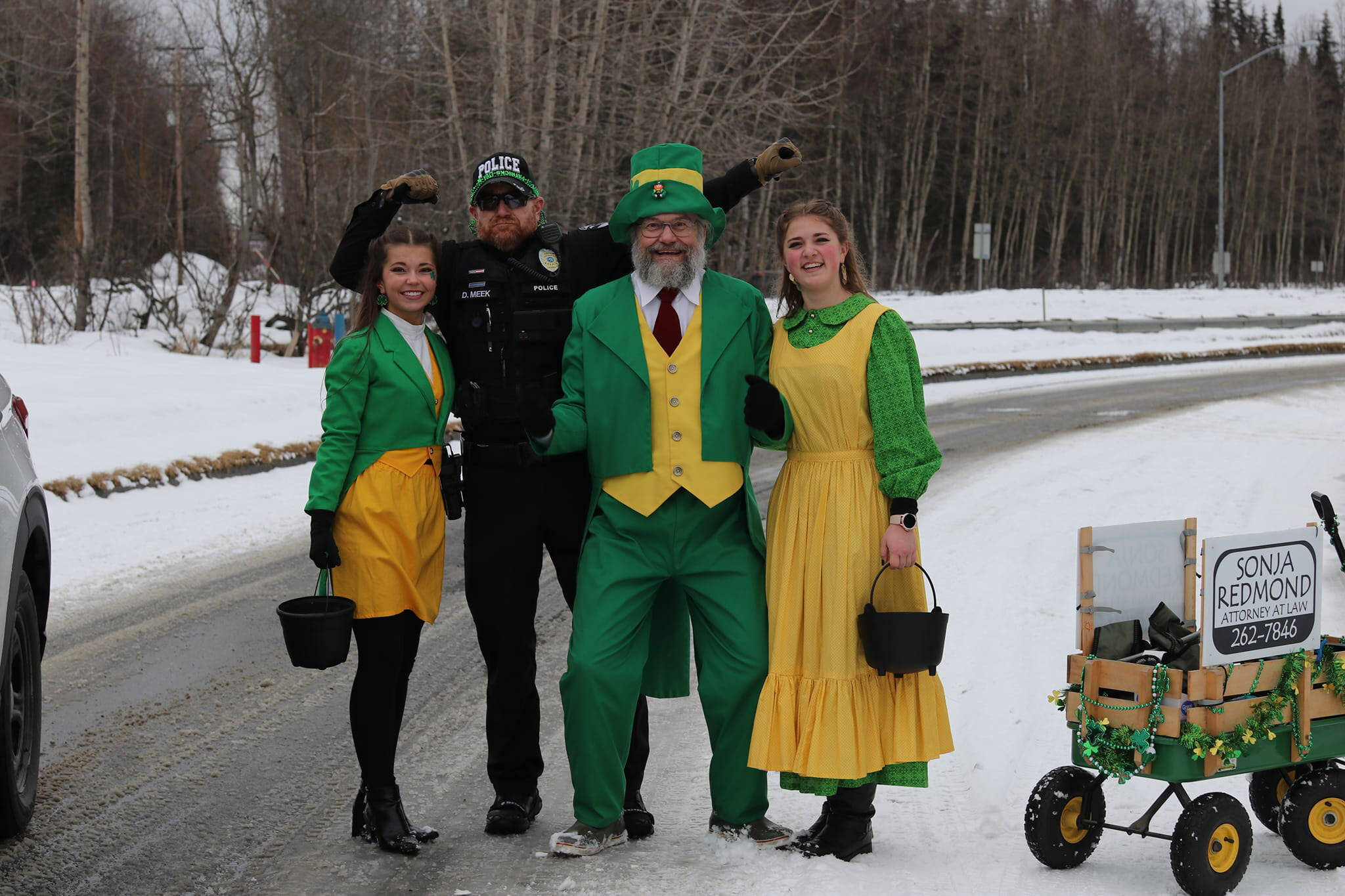 Soldotna Police Chief Gene Meek stands for a photo with participants of the Sweeney’s St. Patrick’s Day Parade in Soldotna, Alaska, on Sunday, March 17, 2024. (Photo provided by Shona DeVolld)