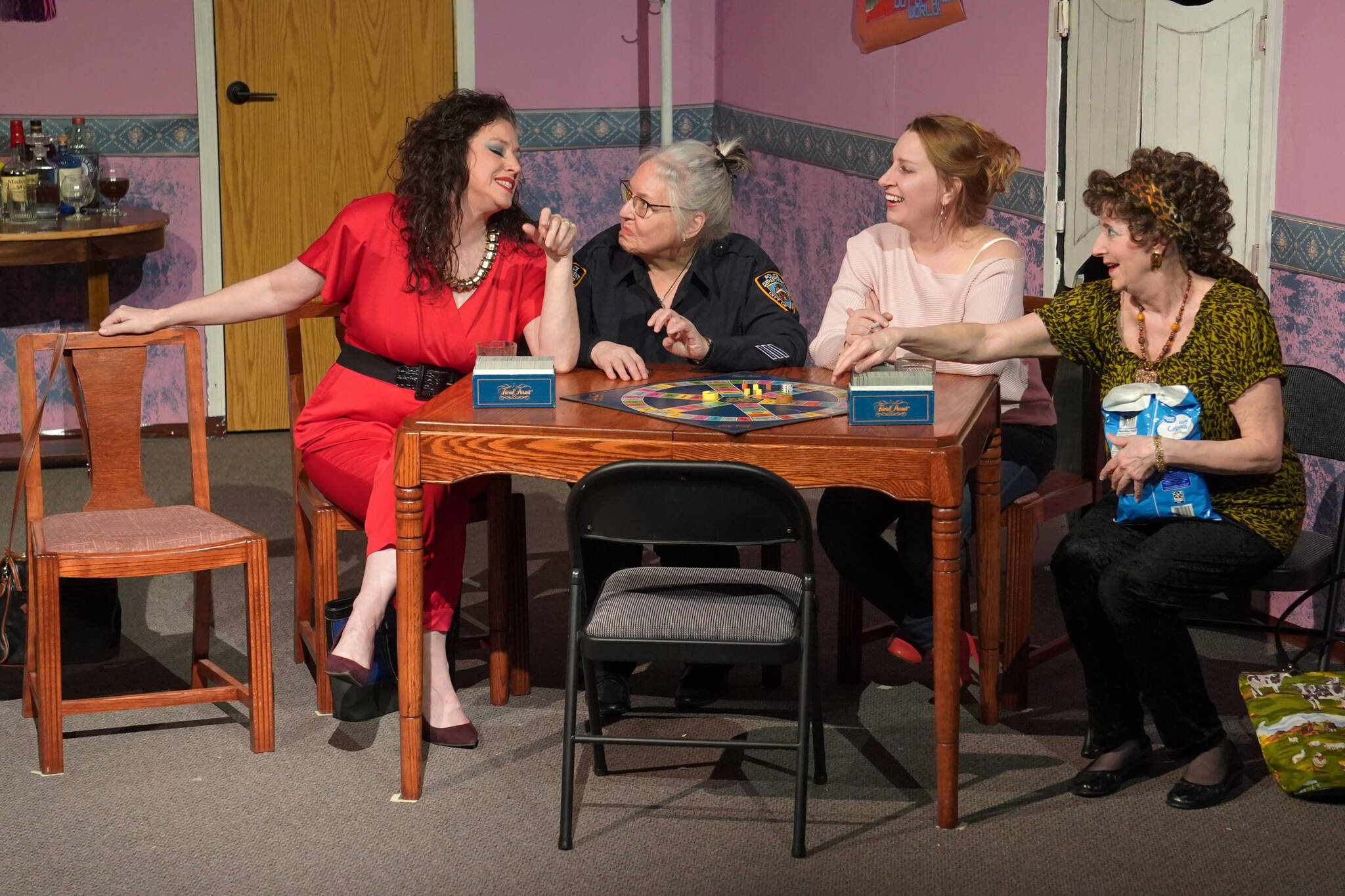 Amy Burton, Yvette Tappana, AnnMarie Rudstrom and Cheri Johnson rehearse “The Odd Couple: The Female Version” at the Kenai Performers’ Theater near Soldotna, Alaska, on Tuesday, March 19, 2024. (Jake Dye/Peninsula Clarion)