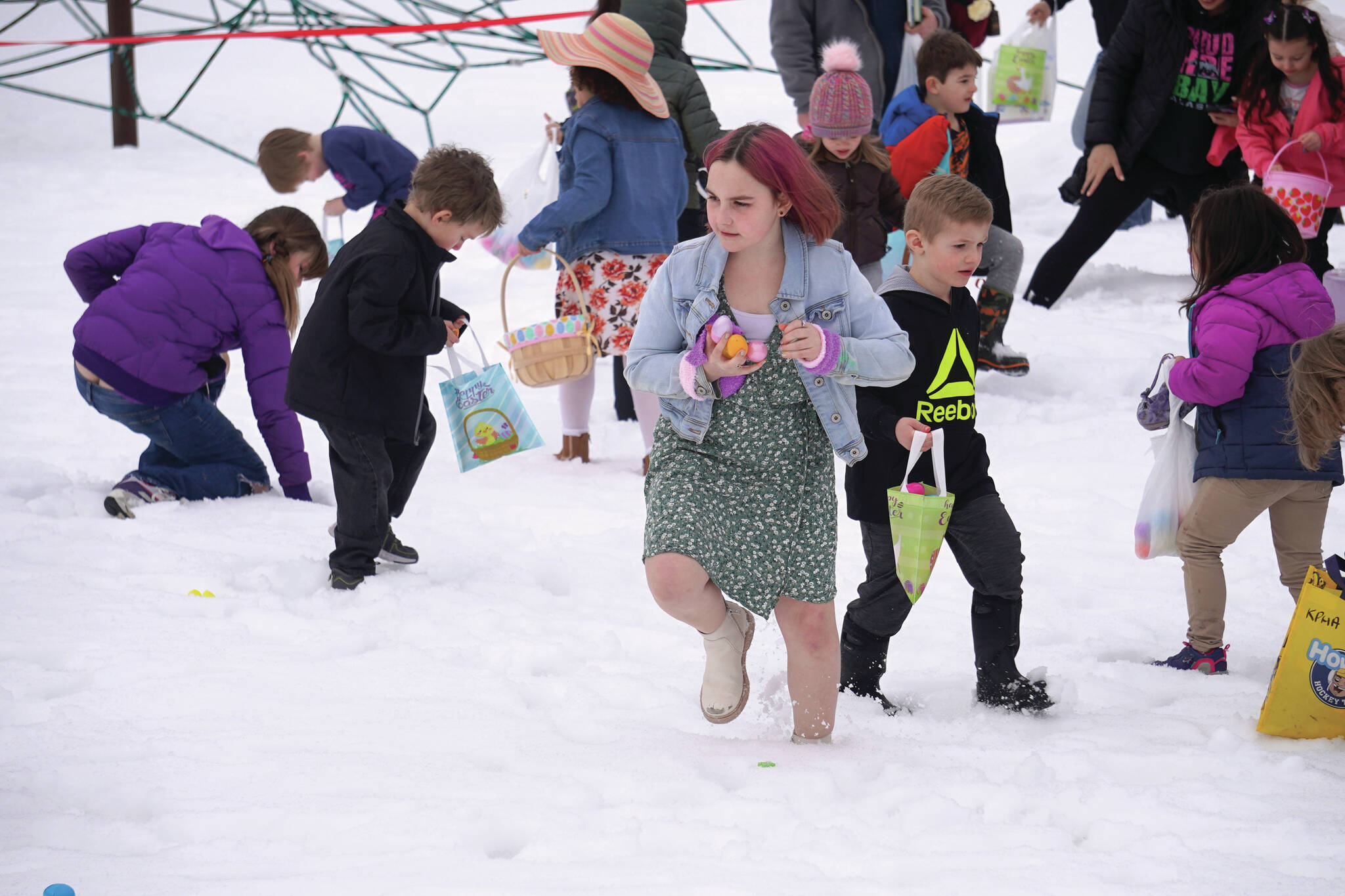 Jake Dye/Peninsula Clarion
Children hunt for Easter eggs during the Easter Eggstravaganza at Nikiski Community Recreation Center on Saturday.