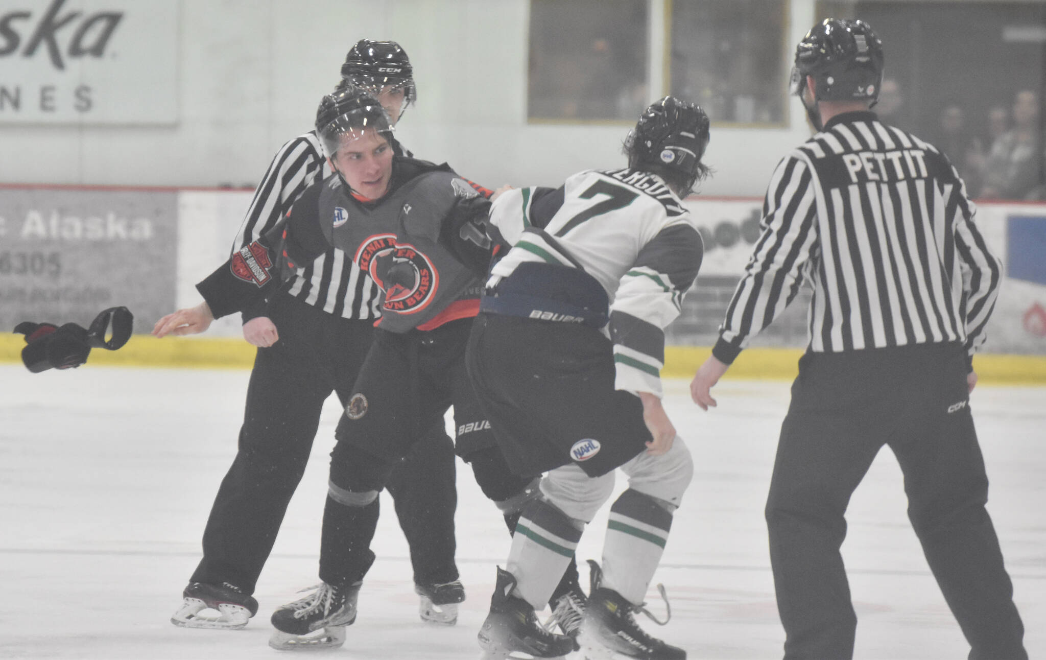 Ryan Hipsag of the Kenai River Brown Bears and Kole Altergott of the Minnesota Wilderness fight Saturday, March 23, 2024, at the Soldotna Regional Sports Complex in Soldotna, Alaska. (Photo by Jeff Helminiak/Peninsula Clarion)