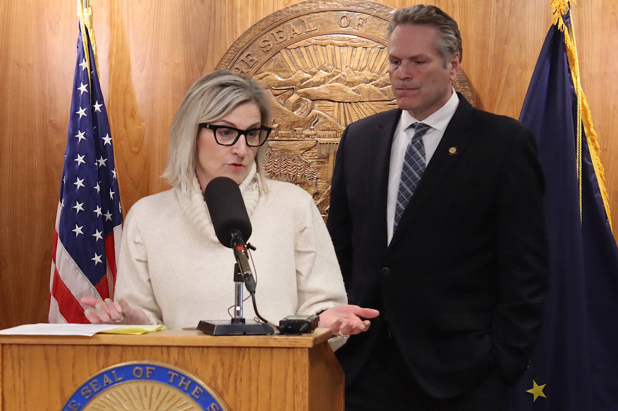 Alaska Department of Education and Early Development Commissioner Deena Bishop and Gov. Mike Dunleavy discuss his veto of an education bill during a press conference Friday, March 15, 2024, at the Alaska State Capitol. (Mark Sabbatini / Juneau Empire)