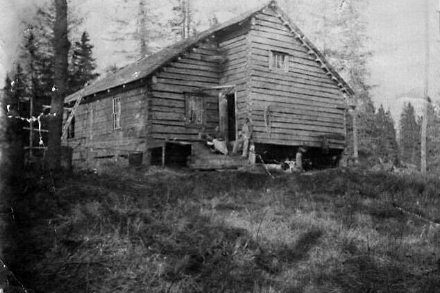 What are almost certainly members of the Grönroos family pose in front of their Anchor Point home in this undated photograph courtesy of William Wade Carroll. The cabin was built in about 1903-04 just north of the mouth of the Anchor River.