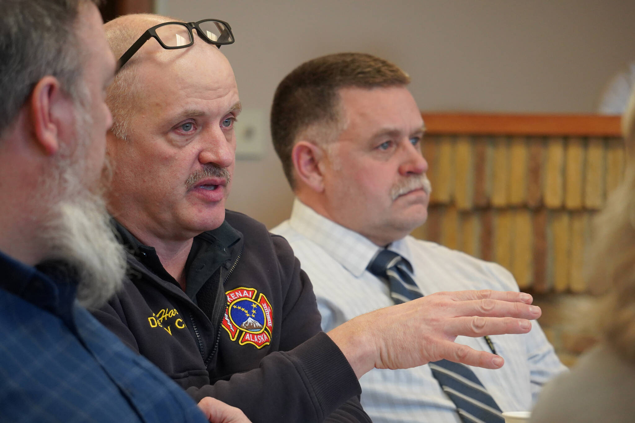 Kenai Fire Department Deputy Chief John Harris and Kenai Police Department Chief David Ross respond to questions about their facility during a work session of the Kenai City Council in Kenai, Alaska, on Wednesday, April 3, 2024. (Jake Dye/Peninsula Clarion)