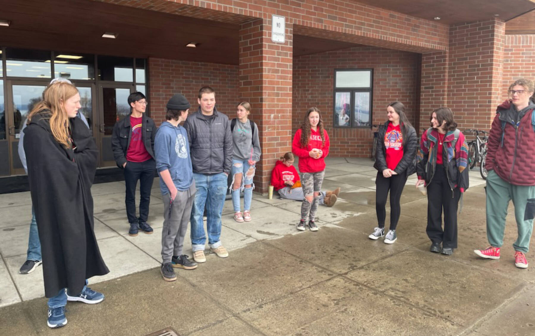 Homer High School students participate in a statewide school walkout organized to protest Gov. Mike Dunleavy’s veto of an education bill that would have increased school funding, Thursday, April 4, 2024, in Homer, Alaska. . (Photo by Emilie Springer/Homer News)