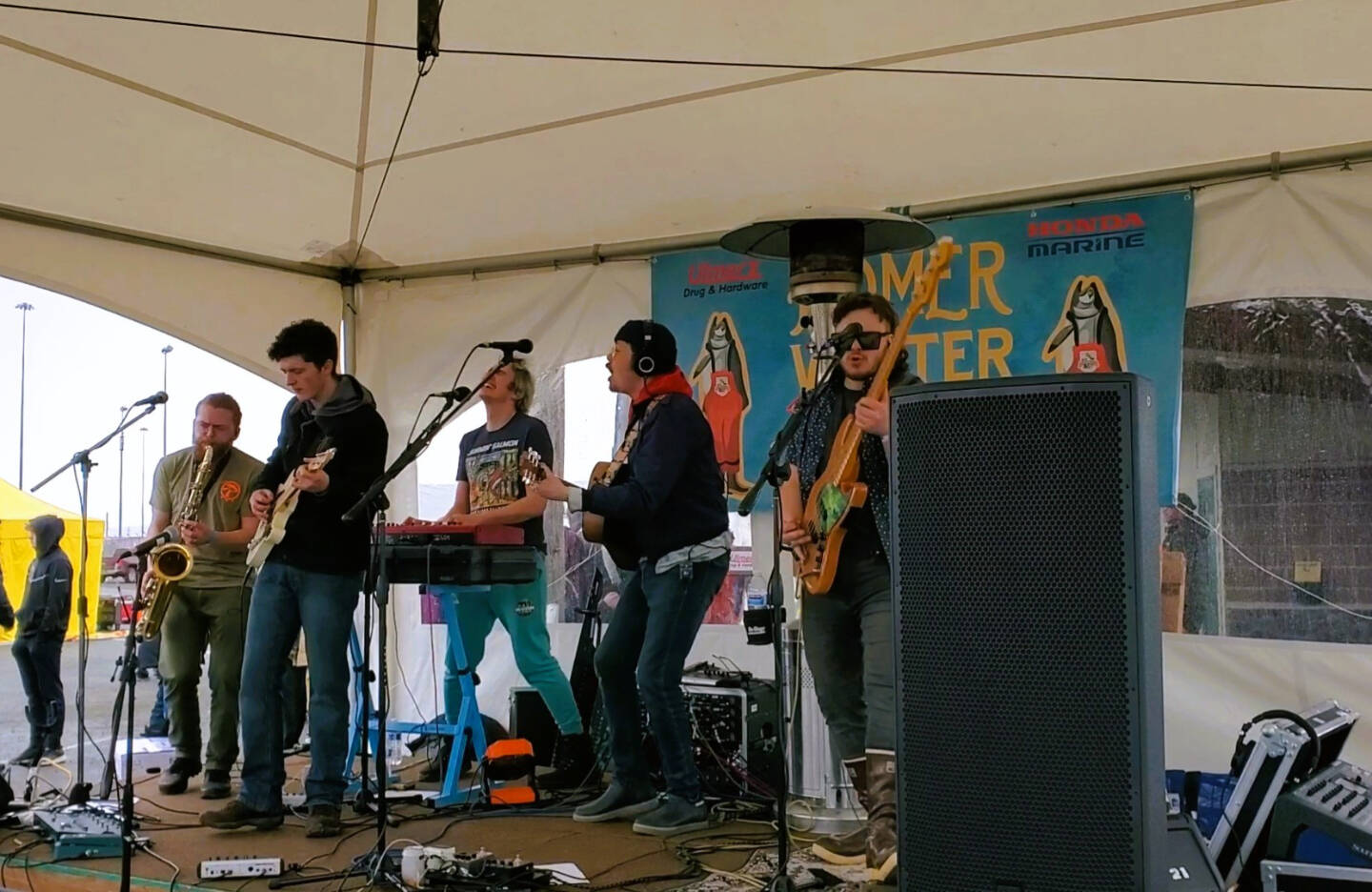 Blackwater Railroad Company and Silas Jones (front left) play at the 30th annual Homer Winter King Salmon Tournament on Saturday, March 23, 2024 at the Deep Water Dock on the Spit in Homer, Alaska. (Delcenia Cosman/Homer News)