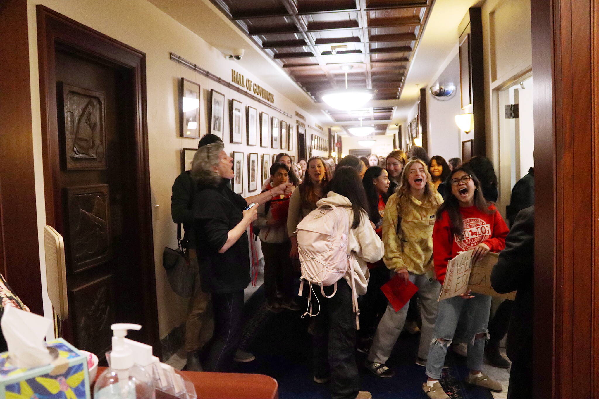 Juneau students chant outside the governor’s office on the third floor of the Alaska State Capitol during a statewide protest Thursday morning calling for more public education funding. (Mark Sabbatini / Juneau Empire)