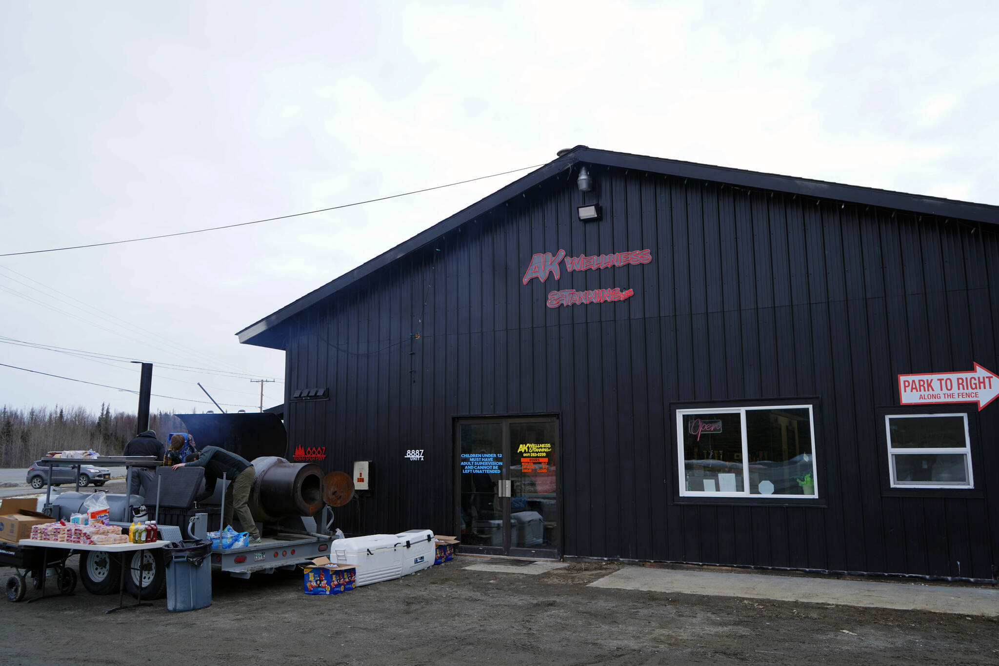 A grill is set up for a grand opening at AK Wellness & Tanning in Kenai, Alaska, on Saturday, April 6, 2024. (Jake Dye/Peninsula Clarion)