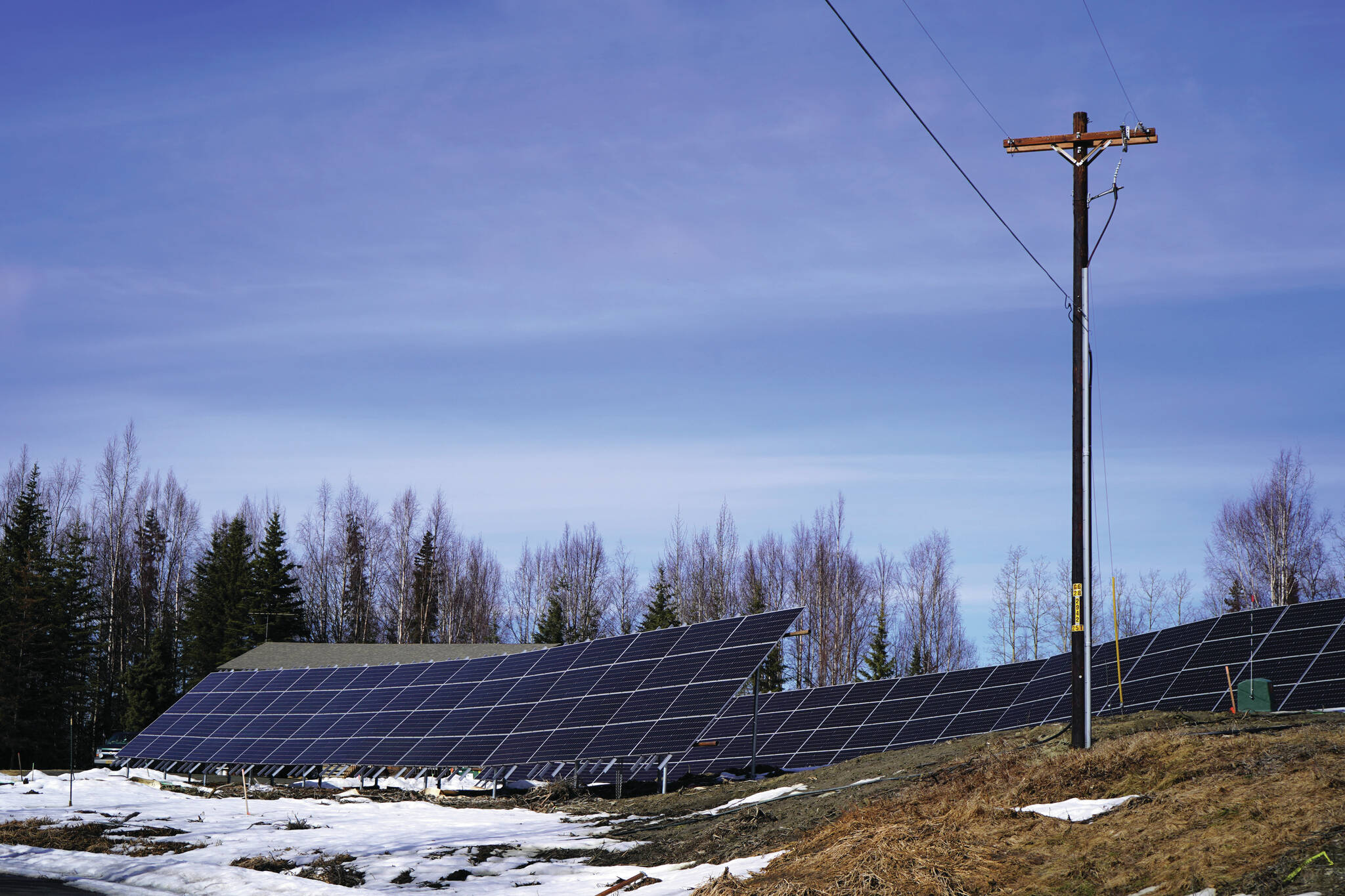An array of solar panels stand in the sunlight at Whistle Hill in Soldotna, Alaska, on Sunday, April 7, 2024. (Jake Dye/Peninsula Clarion)