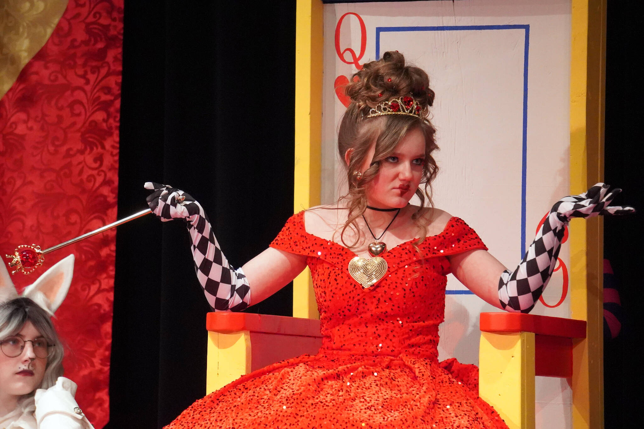 Sophia Hughes is the Queen of Hearts in a rehearsal of Seward High School Theatre Collective’s production of “Alice in Wonderland” at Seward High School in Seward, Alaska, on Thursday, April 11, 2024. (Jake Dye/Peninsula Clarion)