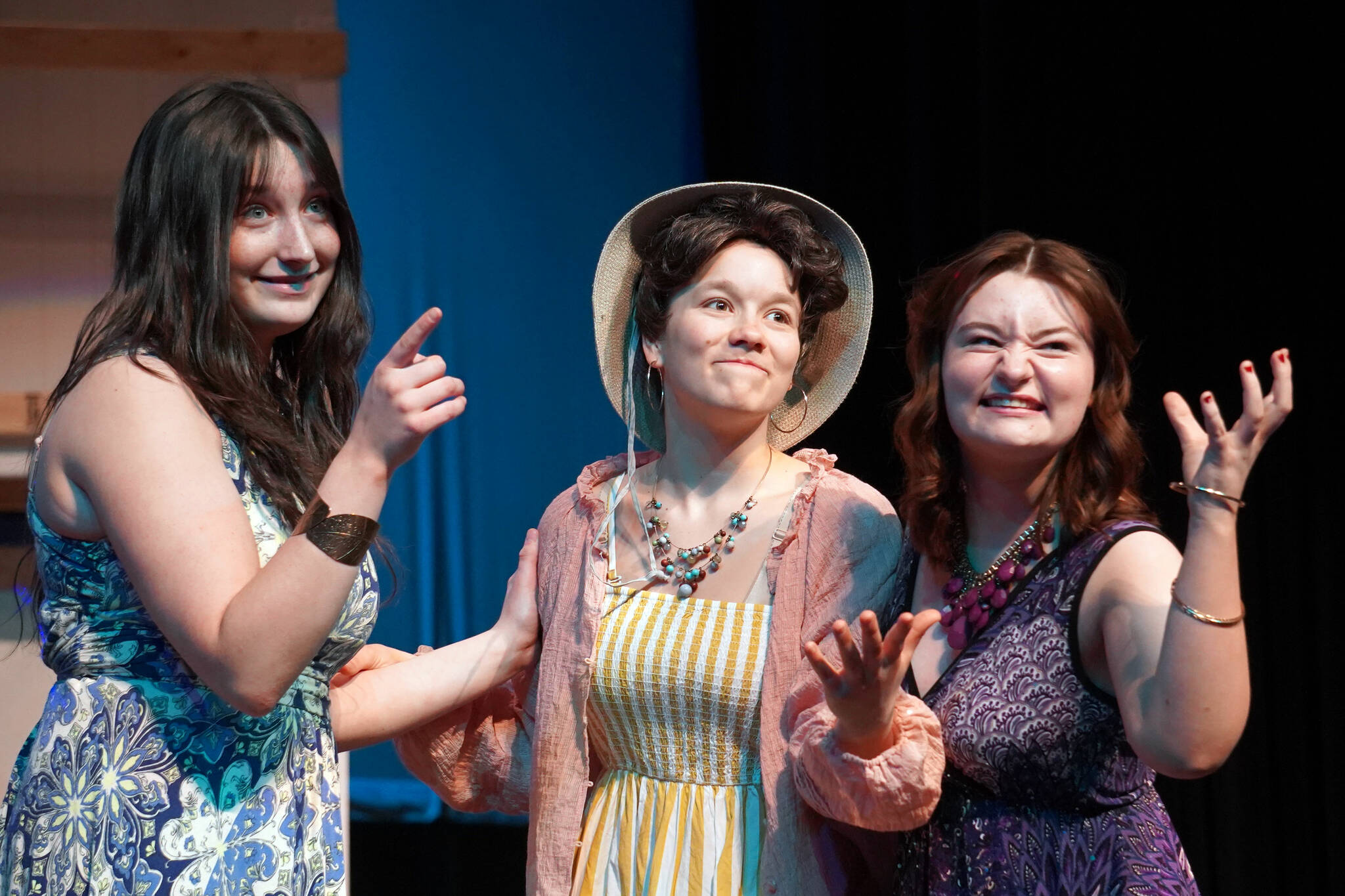 Leora McCaughey, Maggie Grenier and Oshie Broussard rehearse “Mamma Mia” at Nikiski Middle/High School in Nikiski, Alaska, on Tuesday, April 16, 2024. (Jake Dye/Peninsula Clarion)