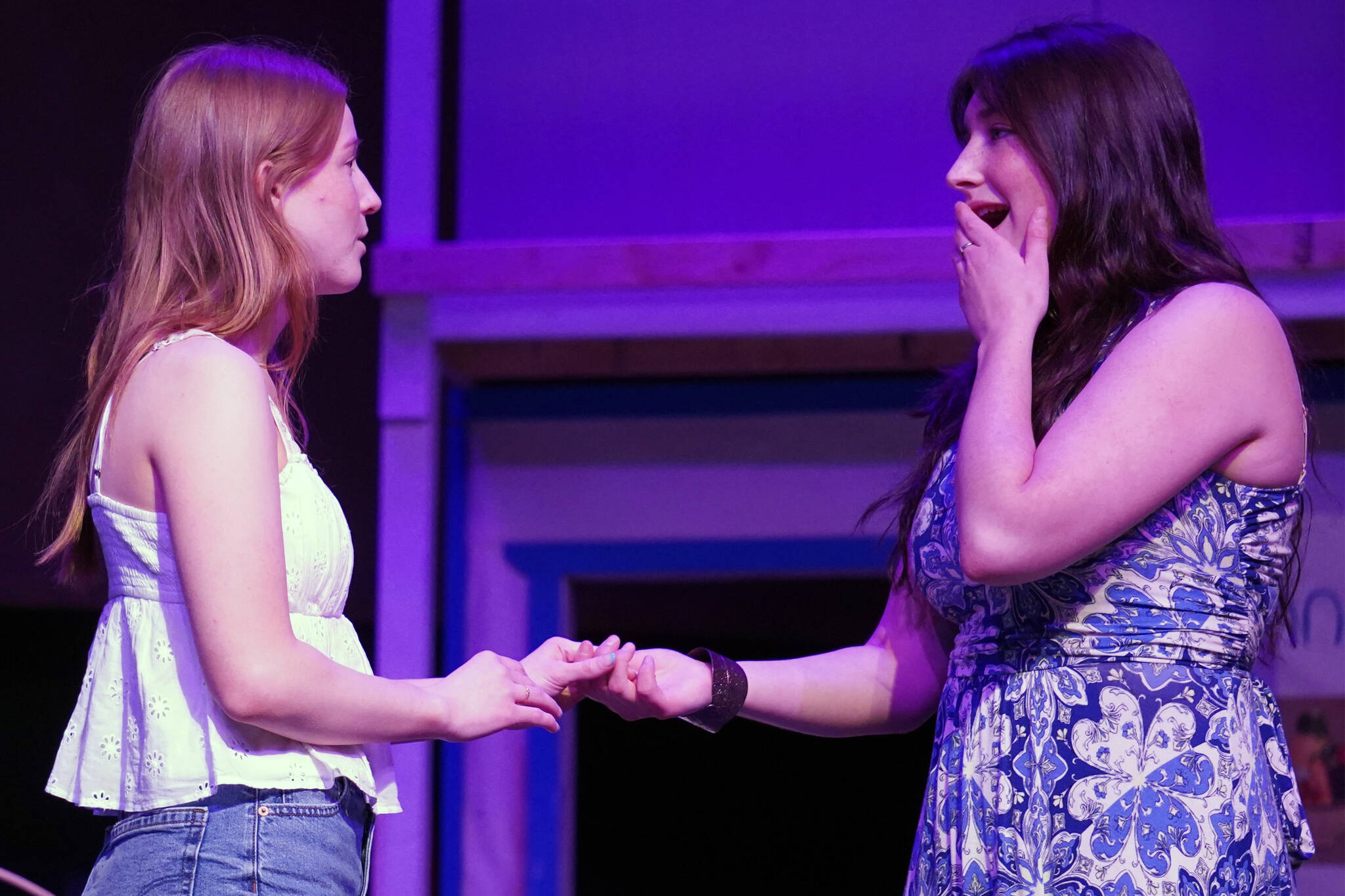 Julia Smith and Leora McCaughey rehearse “Mamma Mia” at Nikiski Middle/High School in Nikiski, Alaska, on Tuesday, April 16, 2024. (Jake Dye/Peninsula Clarion)