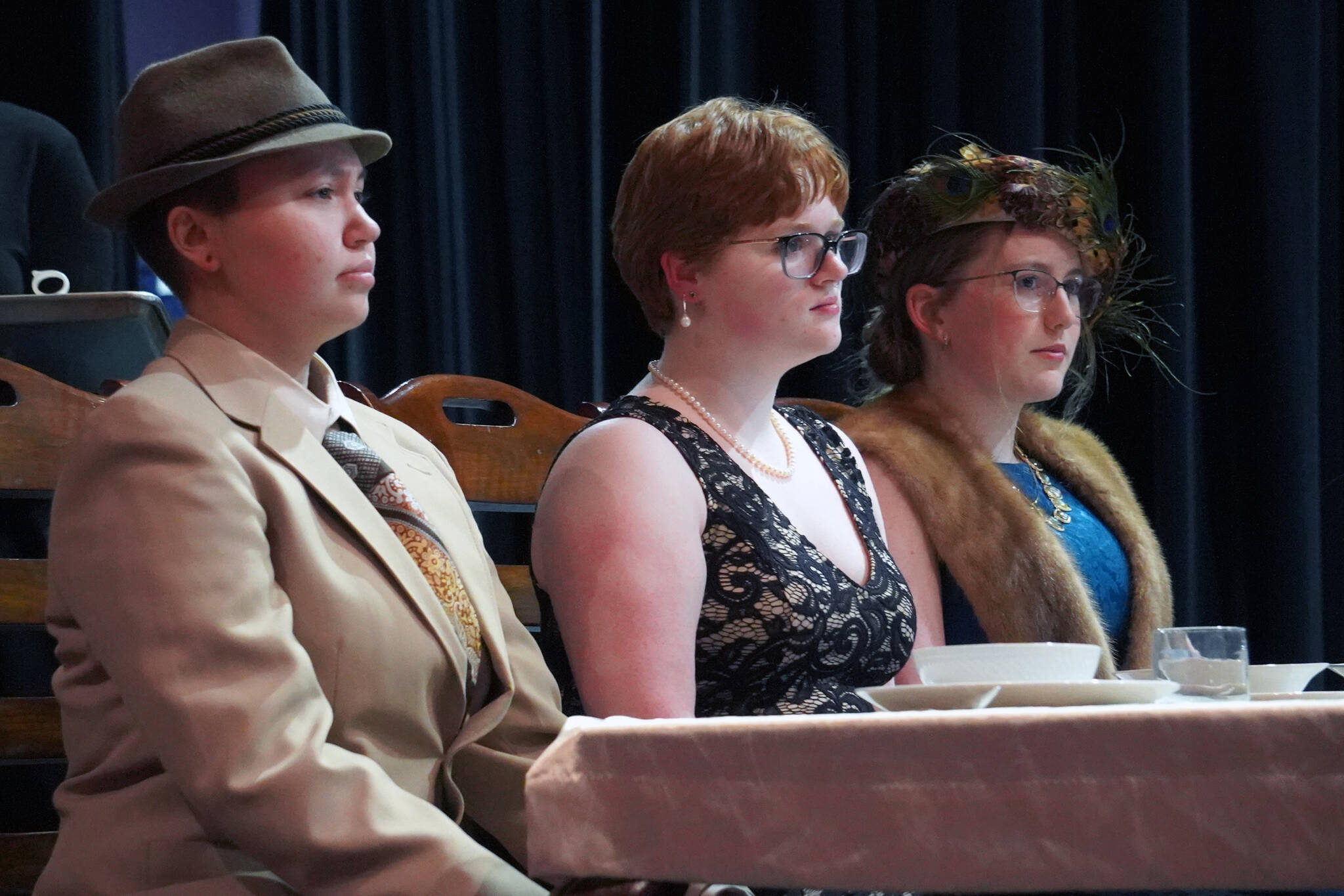 Chloe Jacko, Ada Bon and Emerson Kapp rehearse “Clue” at Soldotna High School in Soldotna, Alaska, on Thursday, April 18, 2024. (Jake Dye/Peninsula Clarion)