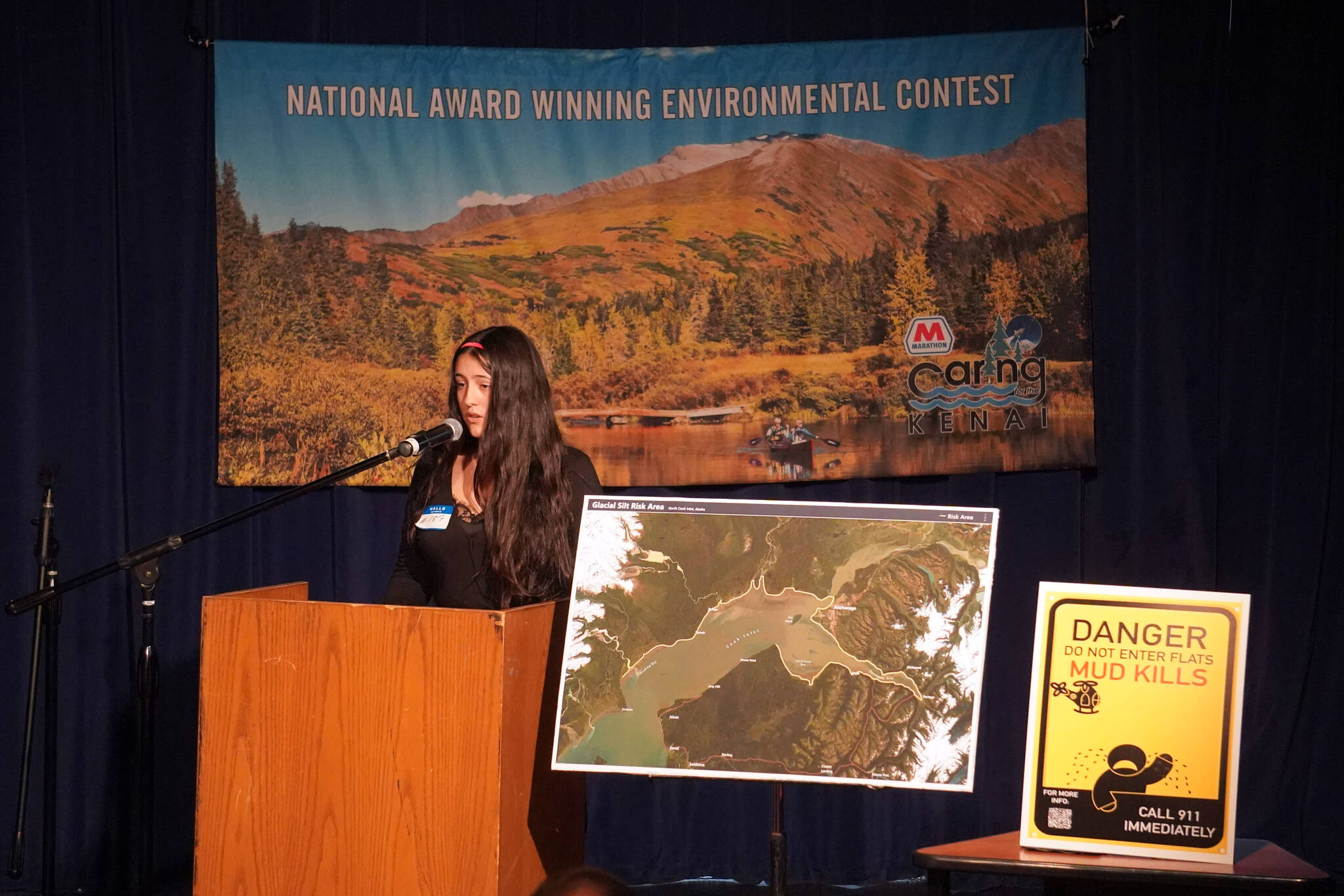 Lucia Micciche presents her proposal for new warning signs around Cook Inlet mud flats to a panel of judges in the 34th Annual Caring for the Kenai Competition at Kenai Central High School in Kenai, Alaska, on Thursday, April 18, 2024. (Jake Dye/Peninsula Clarion)