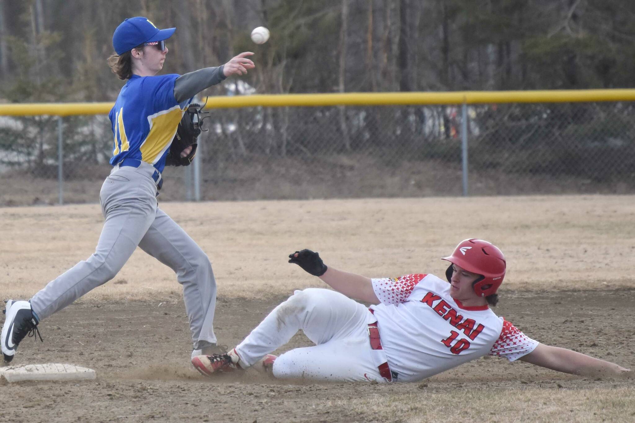 Kodiak's Ejler Durand forces out Kenai Central's Gabe Smith on Friday, April 26, 2024, at the Soldotna Little League fields in Soldotna, Alaska. (Photo by Jeff Helminiak/Peninsula Clarion)