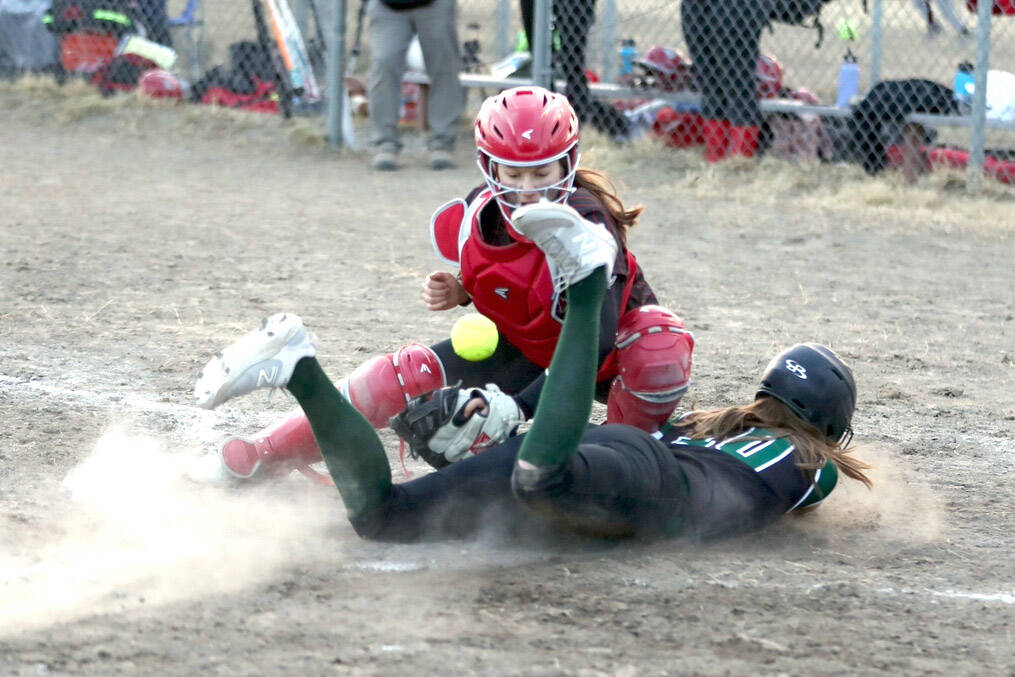 Bruce Eggleston/matsusports.net
Colony's Kara Macy slides into home safely as the ball bounces in front of Kenai Central catcher Maggie Grenier at the Rally in the Valley tournament Thursday, April 25, 2024, at Colony Middle School in Palmer.