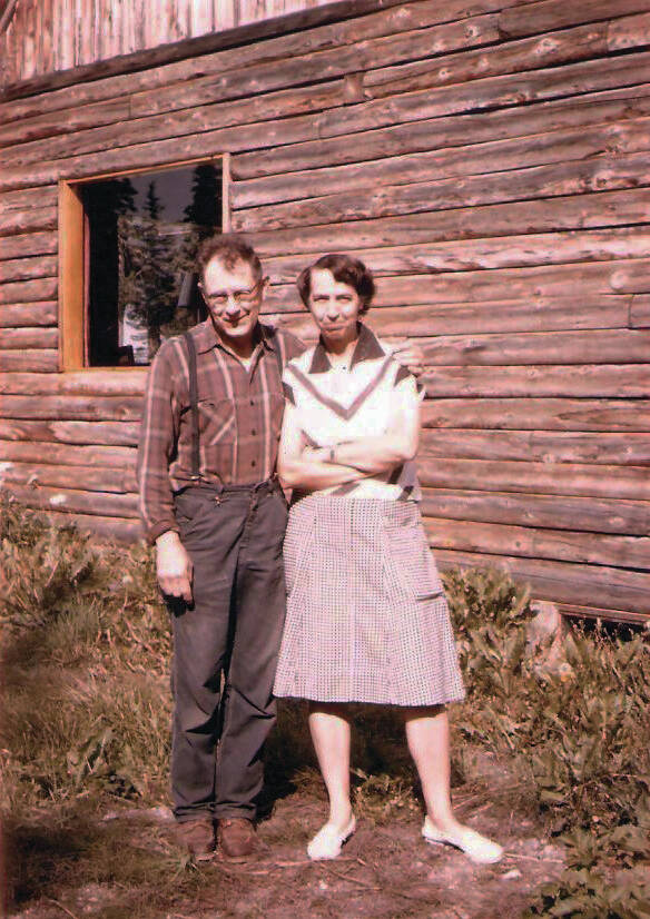 Photo courtesy of Katie Matthews
This is the only known photograph of Rex Hanks, seen here with his wife, Irmgard, next to their two-story home in Happy Valley—circa 1950s.