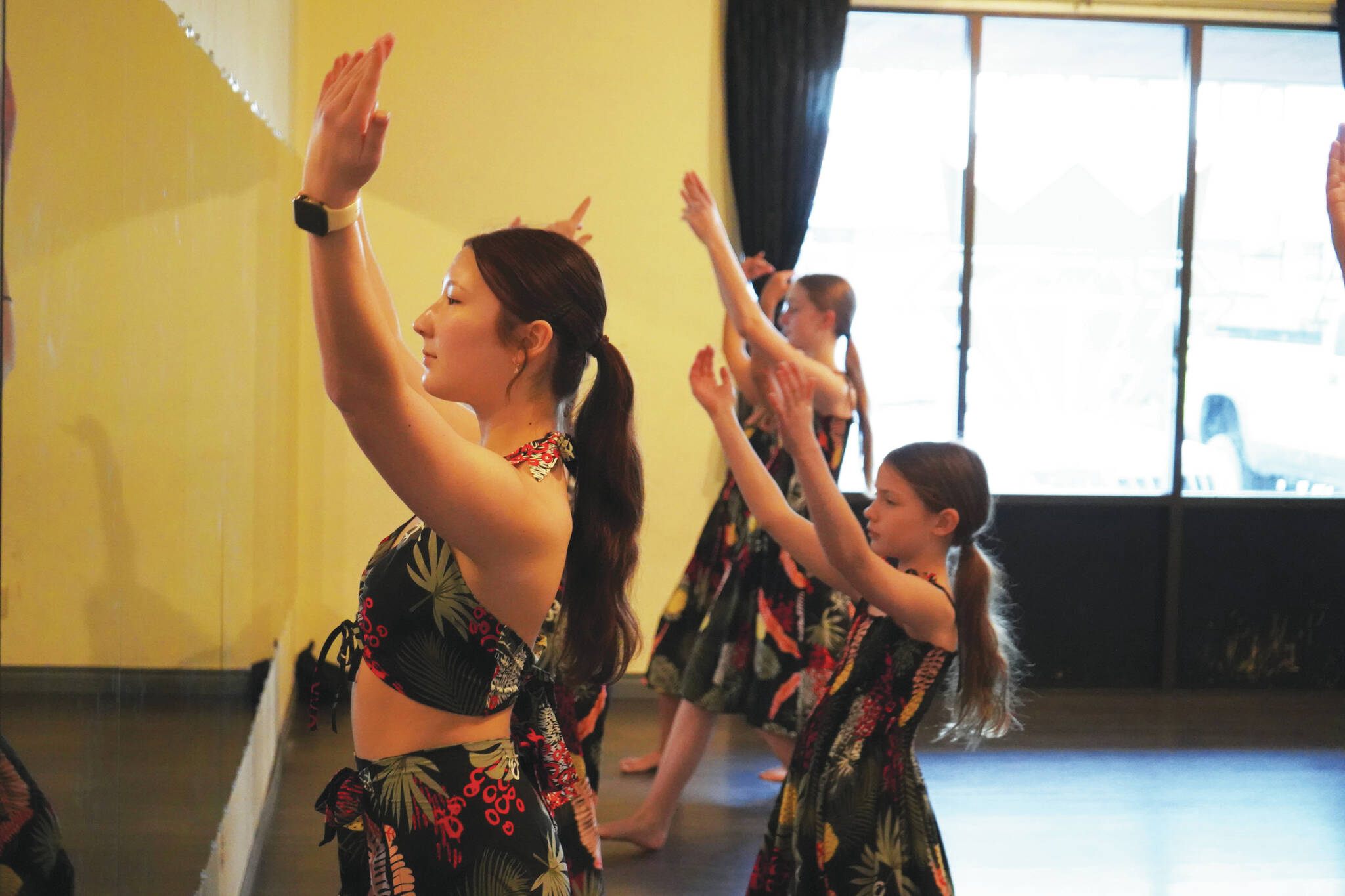 Dancers rehearse a hula routine at Diamond Dance Project near Soldotna, Alaska, on Thursday, Feb. 15, 2024. (Jake Dye/Peninsula Clarion)