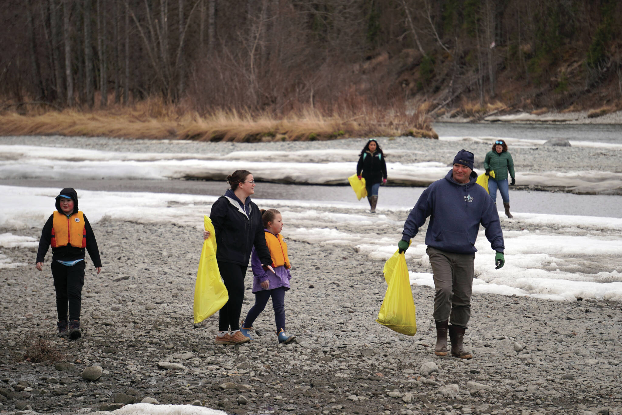 Jake Dye/Peninsula Clarion
Students of Soldotna Montessori Charter School comb for trash along the banks of the Kenai River at Centennial Park in Soldotna on Thursday.