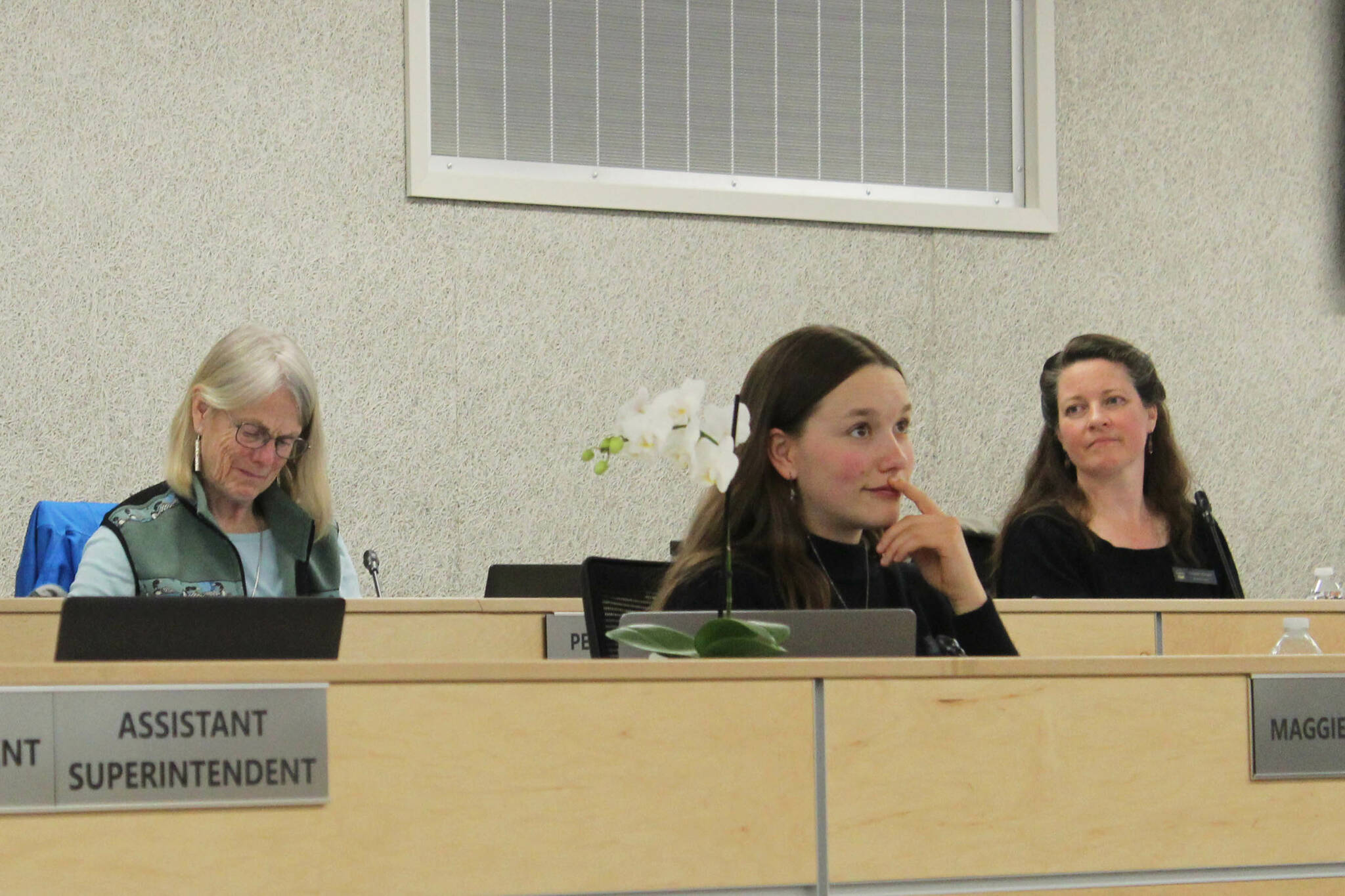 Nikiski Middle/High School senior Maggie Grenier, center, participates in her final school board meeting as student representative on Monday, May 6, 2024 in Soldotna, Alaska. (Ashlyn O’Hara/Peninsula Clarion)