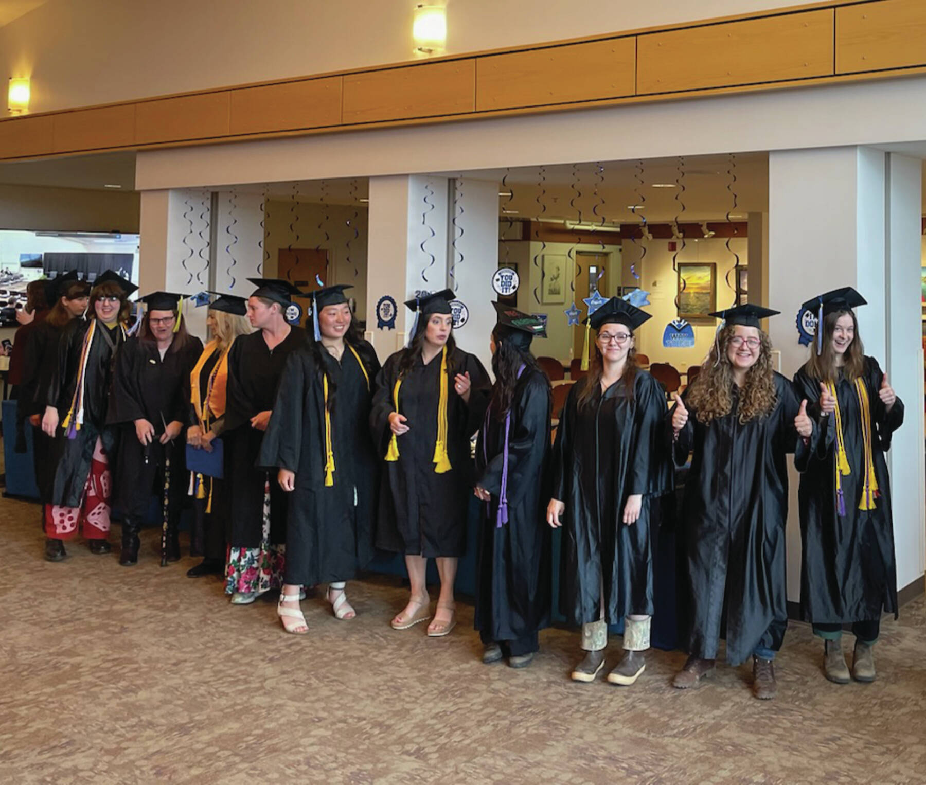 Emilie Springer/ Homer News
Kachemak Bay Campus 2024 graduates preparing to enter commencement at the campus on May 8.