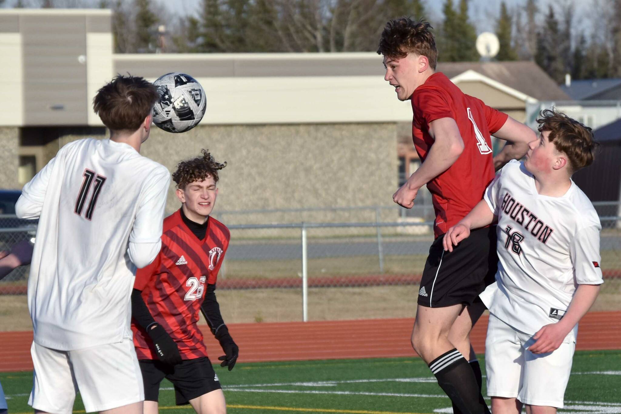 Kenai Central's Ryker Dykema heads in a corner kick for a goal Thursday, May 9, 2024, at Kenai Central High School in Kenai, Alaska. (Photo by Jeff Helminiak/Peninsula Clarion)