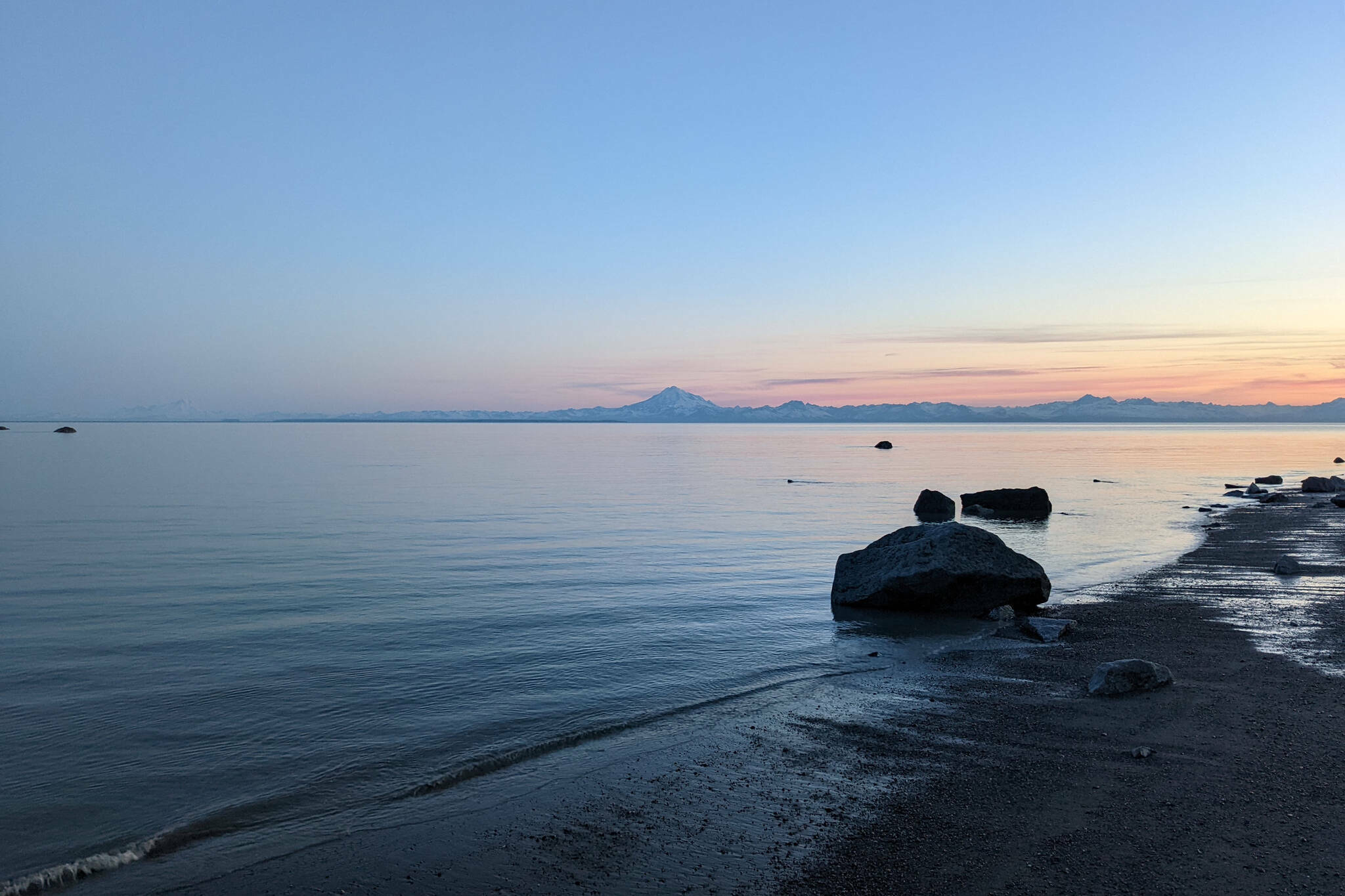 Mount Redoubt can be seen across Cook Inlet from North Kenai Beach on Thursday, July 2, 2022. (Erin Thompson/Peninsula Clarion file photo)