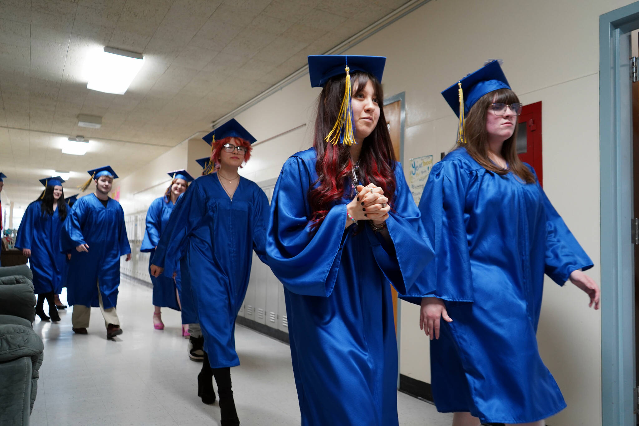Students of Kenai Alternative High School proceed into a graduation ceremony in the school’s gym in Kenai, Alaska, on Tuesday, May 14, 2024. (Jake Dye/Peninsula Clarion)