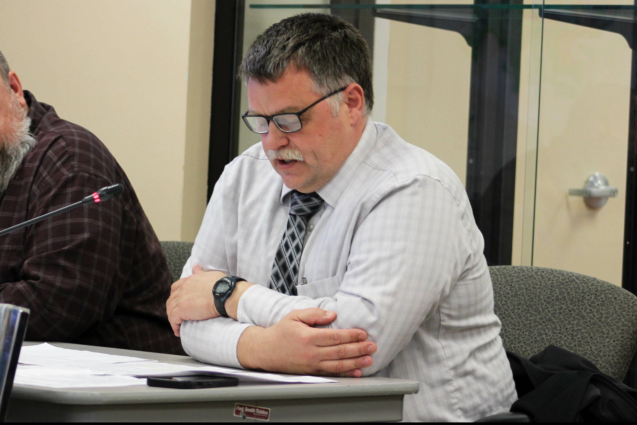 Kenai Police Chief David Ross speaks to Kenai City Council members about an ordinance that would repeal sections of city code that prohibit public sleeping and loitering and the city’s curfew on Wednesday, May 15, 2024, in Kenai, Alaska. (Ashlyn O’Hara/Peninsula Clarion)