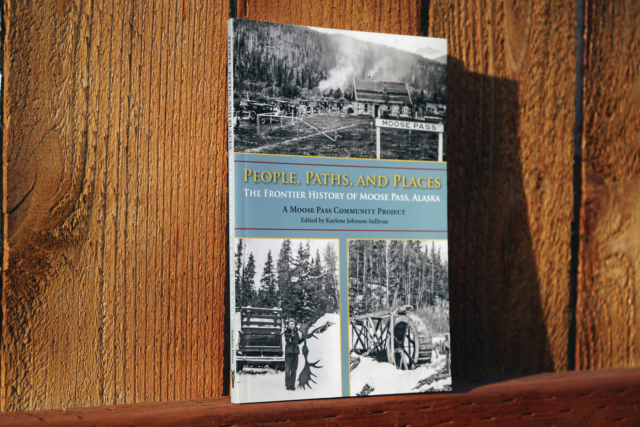 Jake Dye/Peninsula Clarion
A copy of “People, Paths, and Places: The Frontier History of Moose Pass, Alaska” stands in sunlight in Soldotna on Friday.