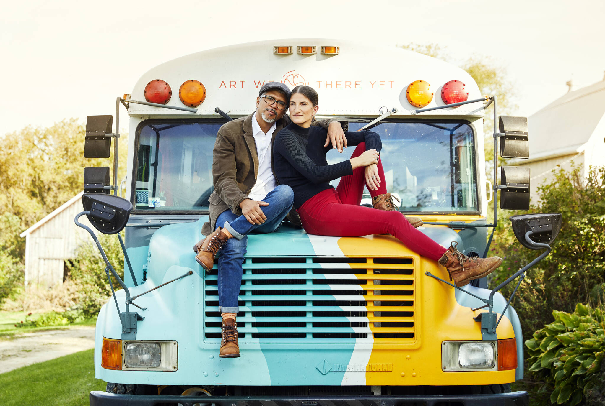 José Luis Vílchez and Cora Rose with their retired school bus-turned-art and recording studio. (Photo provided by Art We There Yet)