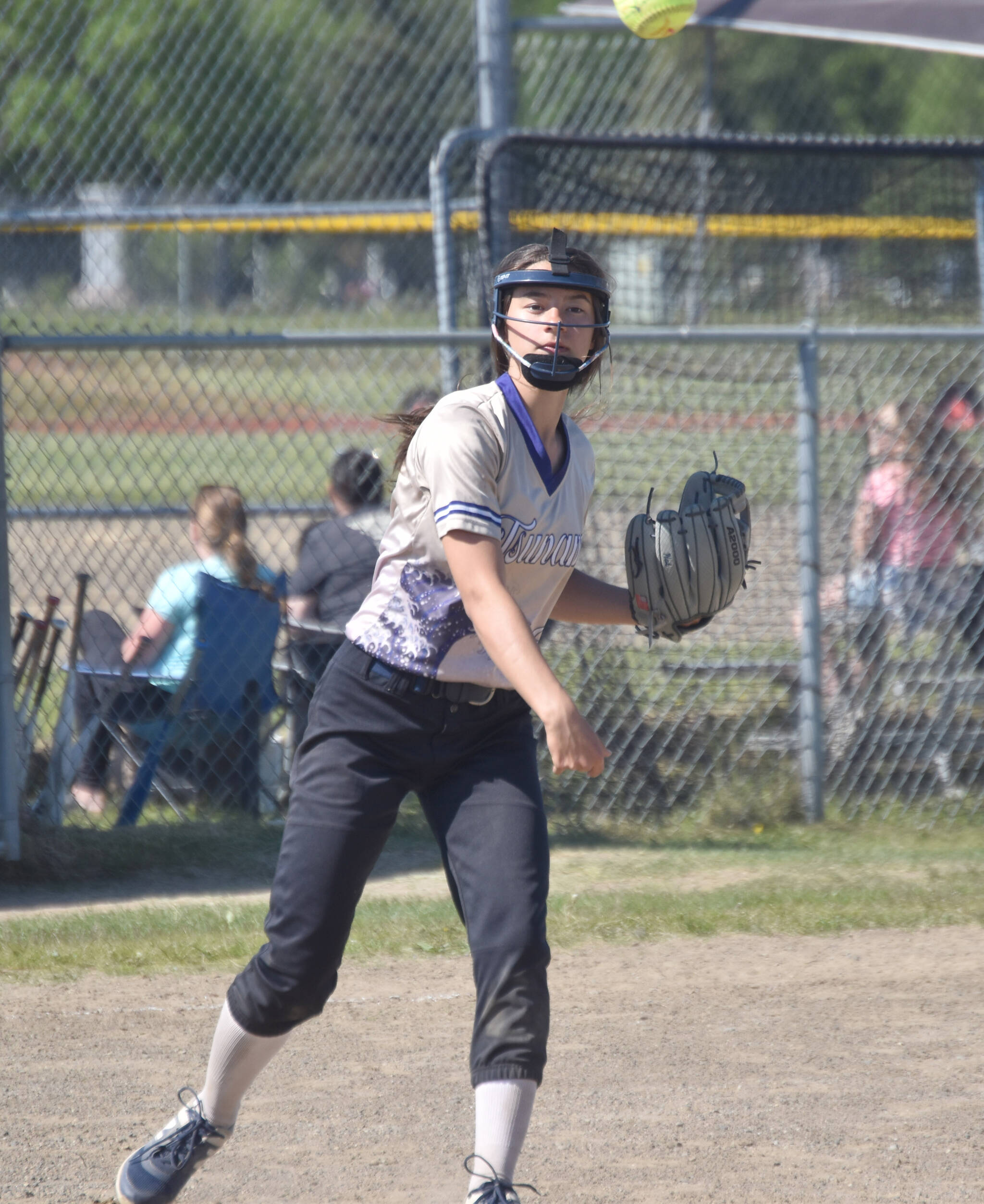 Natalie Farren of Homer Tsunami (U16) throws in time to first base against AK Krush (U14) at the USA/Junior Olympic softball tournament at Steve Shearer Memorial Ball Park on Saturday, June 15, 2024, in Kenai, Alaska. (Photo by Jeff Helminiak/Peninsula Clarion)