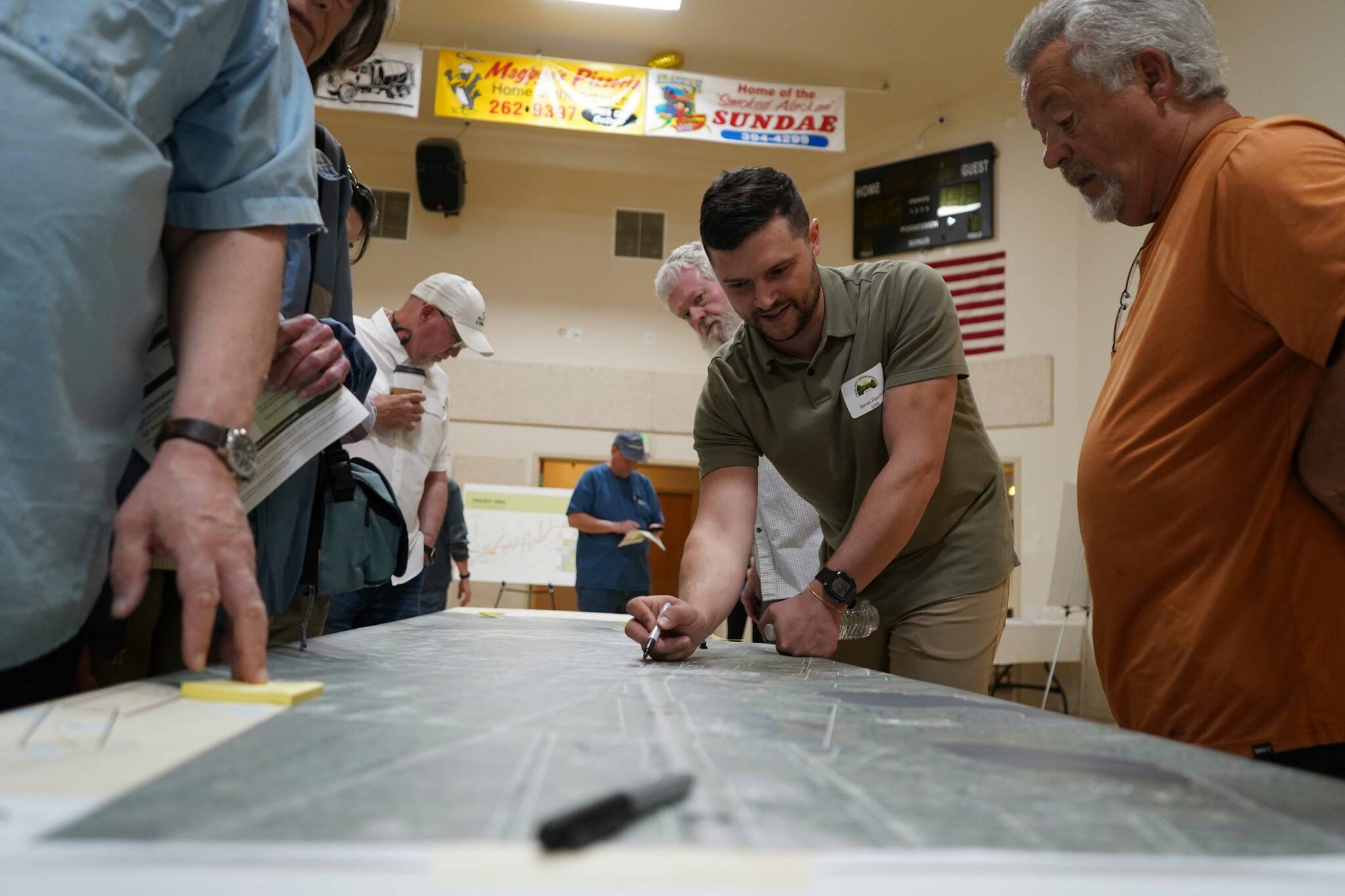 Project staff for the Sterling Safety Corridor Improvements project meet with residents, take feedback and answer questions during a town hall event at the Sterling Community Center in Sterling, Alaska, on Tuesday, June 25, 2024. (Jake Dye/Peninsula Clarion)